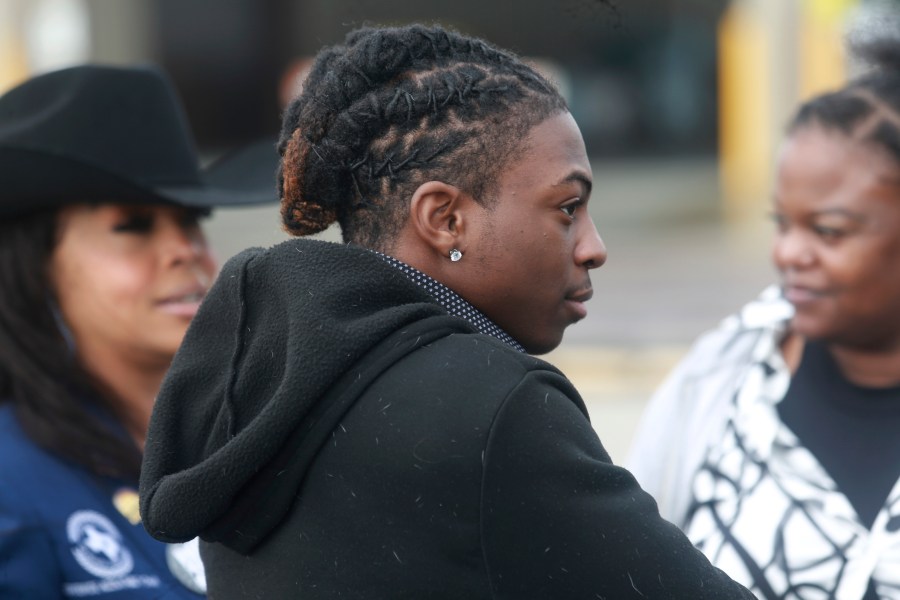 FILE - Darryl George, an 18-year-old high school junior, stands outside a courthouse in Anahuac, Texas, on Wednesday, Jan. 24, 2024, following a court hearing over whether his Houston-area school district can continue to punish him for refusing to change his hairstyle. For as long as schools have policed hairstyles as part of their dress codes, some students have seen the rules as attempts to deny their cultural and religious identities. To school administrators, strict dress codes can be tools for promoting uniformity and discipline. (AP Photo/Lekan Oyekanmi, File)