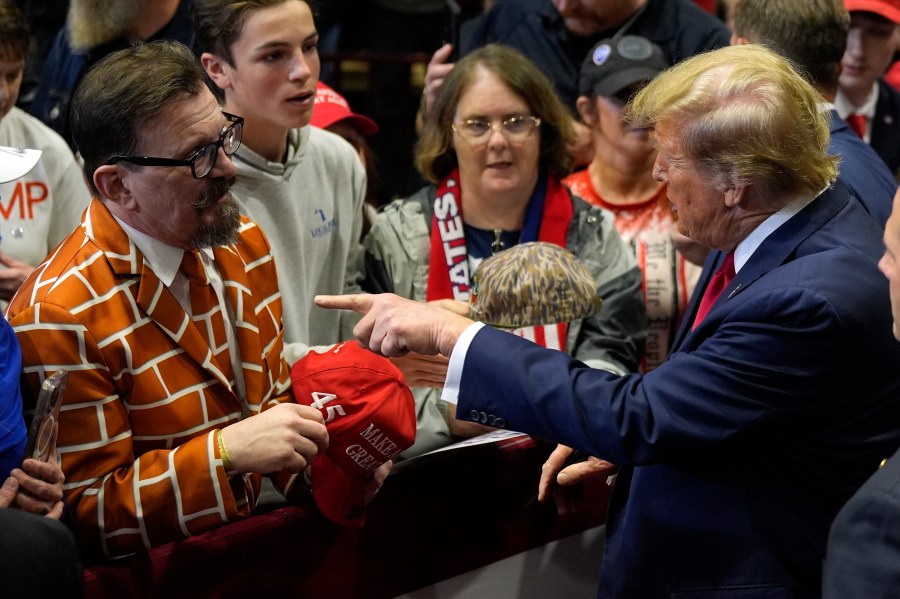 Republican presidential candidate former President Donald Trump greets a supporter at a campaign rally Friday, Feb. 23, 2024, in Rock Hill, S.C. (AP Photo/Chris Carlson)