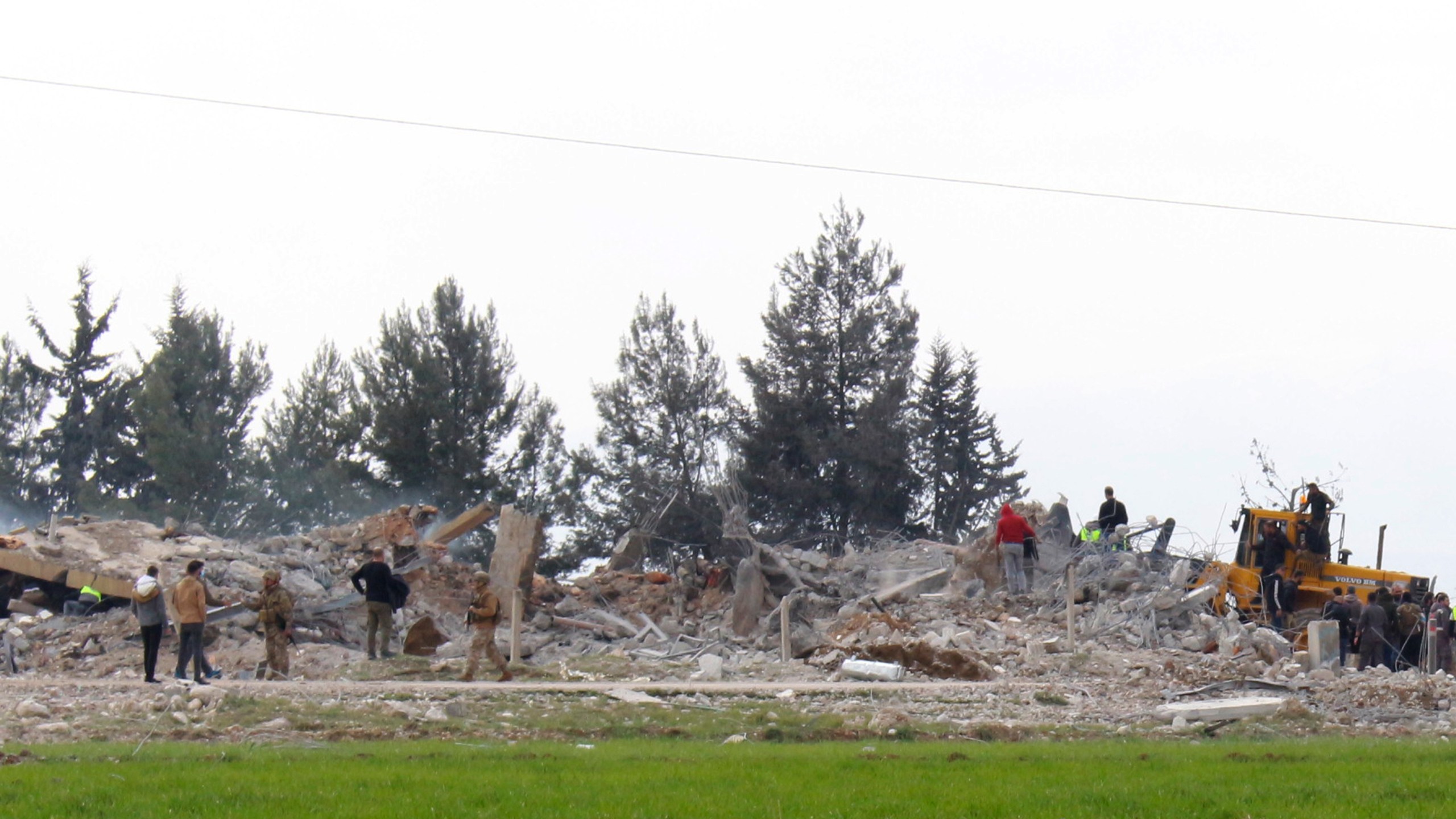 Lebanese soldiers and civil defence workers gather near a destroyed warehouse which was attacked by Israeli airstrikes, on the outskirts of the Hezbollah stronghold village of Buday, near Baalbek town, east Lebanon, Monday, Feb. 26, 2024. The Israeli military says its air force struck targets of the militant Hezbollah group "deep inside Lebanon," where residents reported explosions near the northeastern city of Baalbek. (AP Photo)