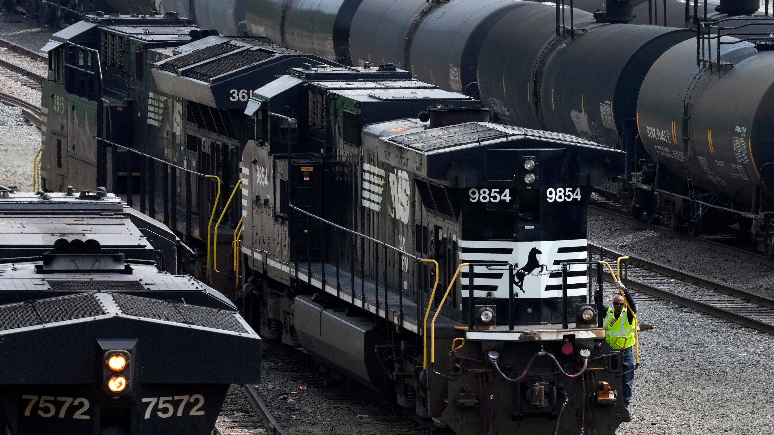 FILE - Norfolk Southern locomotives are moved through the Conway Terminal in Conway, Pa., June 17, 2023. Norfolk Southern wants its shareholders to back its current management team and strategy and reject a bid from a group of investors to take over the railroad. Norfolk Southern urged shareholders Monday, Feb. 26, 2024 to reject Ancora Holdings eight board nominees when it filed its proxy statement. (AP Photo/Gene J. Puskar, file)