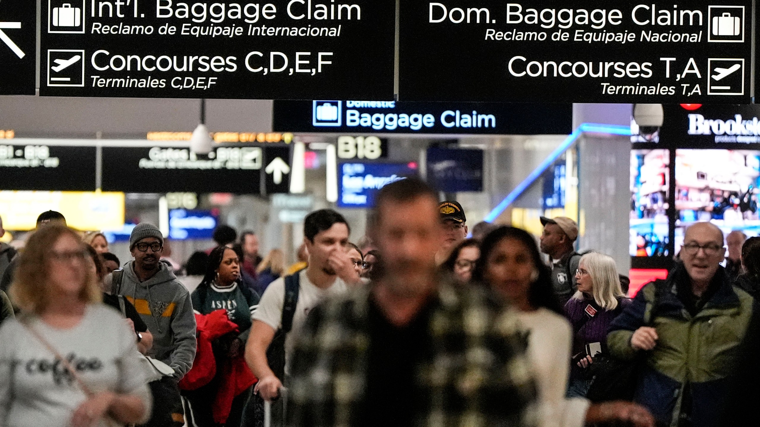 Travelers move through the B terminal at Hartsfield-Jackson Atlanta International Airport, Saturday, Jan. 27, 2024, in Atlanta. On Tuesday, Feb. 27, 2024, the Conference Board reports on U.S. consumer confidence for February. (AP Photo/Mike Stewart)