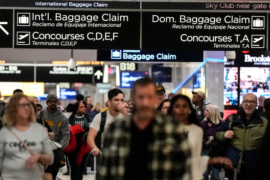 Travelers move through the B terminal at Hartsfield-Jackson Atlanta International Airport, Saturday, Jan. 27, 2024, in Atlanta. On Tuesday, Feb. 27, 2024, the Conference Board reports on U.S. consumer confidence for February. (AP Photo/Mike Stewart)