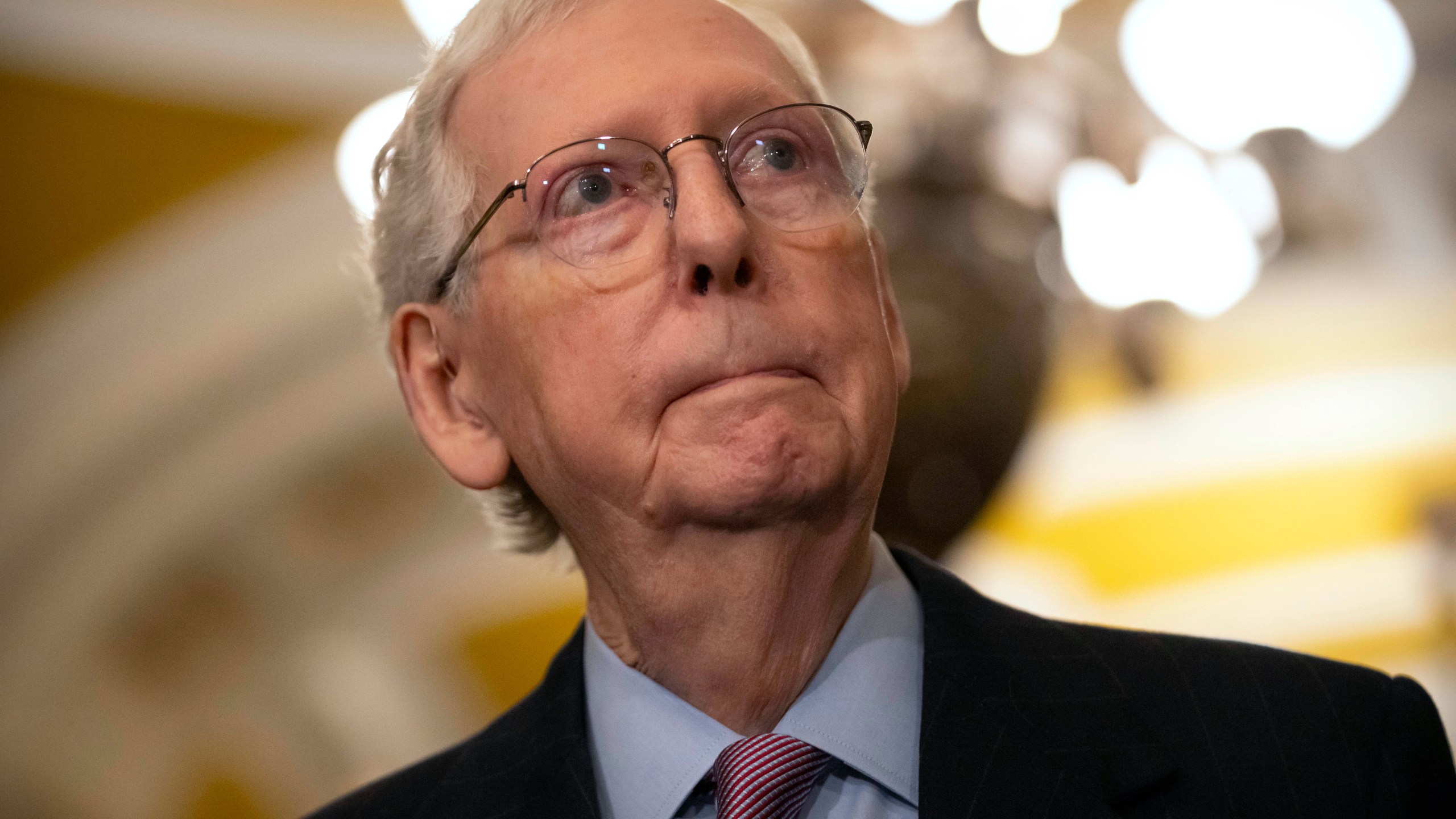 Senate Minority Leader Mitch McConnell of Ky., listens to a reporter's question during a press availability on Capitol Hill, Tuesday, Feb. 27, 2024, in Washington. President Joe Biden implored the top four leaders of Congress to act quickly to avoid a looming government shutdown early next month and to pass emergency aid for Ukraine and Israel, as a legislative logjam in the GOP-led House showed no signs of abating. (AP Photo/Mark Schiefelbein)