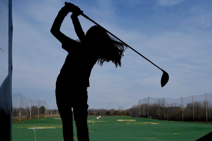 A golfer hits range balls during a warm day in Des Plaines, Ill., Tuesday, Feb. 27, 2024. Illinois broke a 24 year old temp record with today's estimated 68 degree high and a 98 year old record set back in 1926 appears potentially in jeopardy Tuesday. These readings are May level temps, the equivalent of normal temps which occur here more than 2 months from now. (AP Photo/Nam Y. Huh)