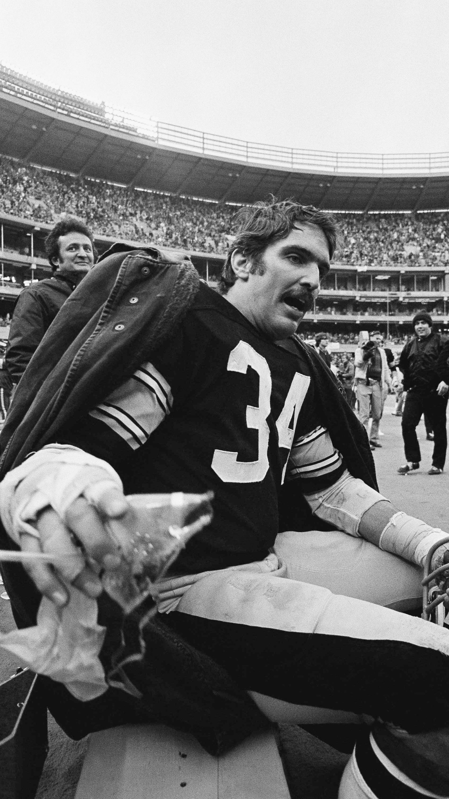 FILE - Steelers linebacker Andy Russell takes a break on the bench during fourth quarter action with the Baltimore Colts at Pittsburgh, Dec. 27, 1975. The Steelers announced Saturday, March 2, 2024 that Russell, a seven-time Pro Bowler and two-time Super Bowl winner during his 12-year career, has died at 82. (AP Photo, File)