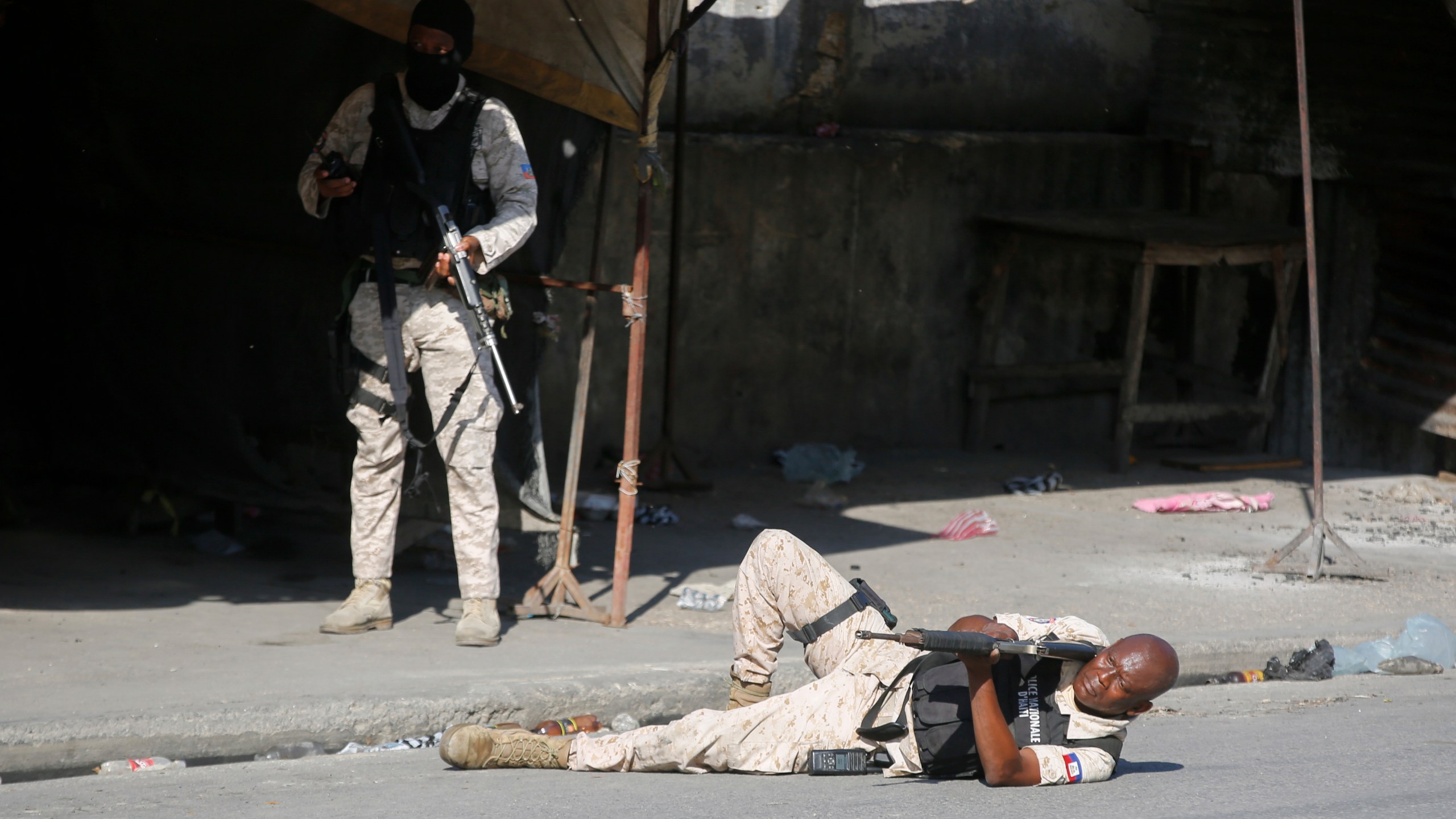 A police aims during clashes with gang members in Port-au-Prince, Haiti, Friday, March 1, 2024. (AP Photo/Odelyn Joseph)