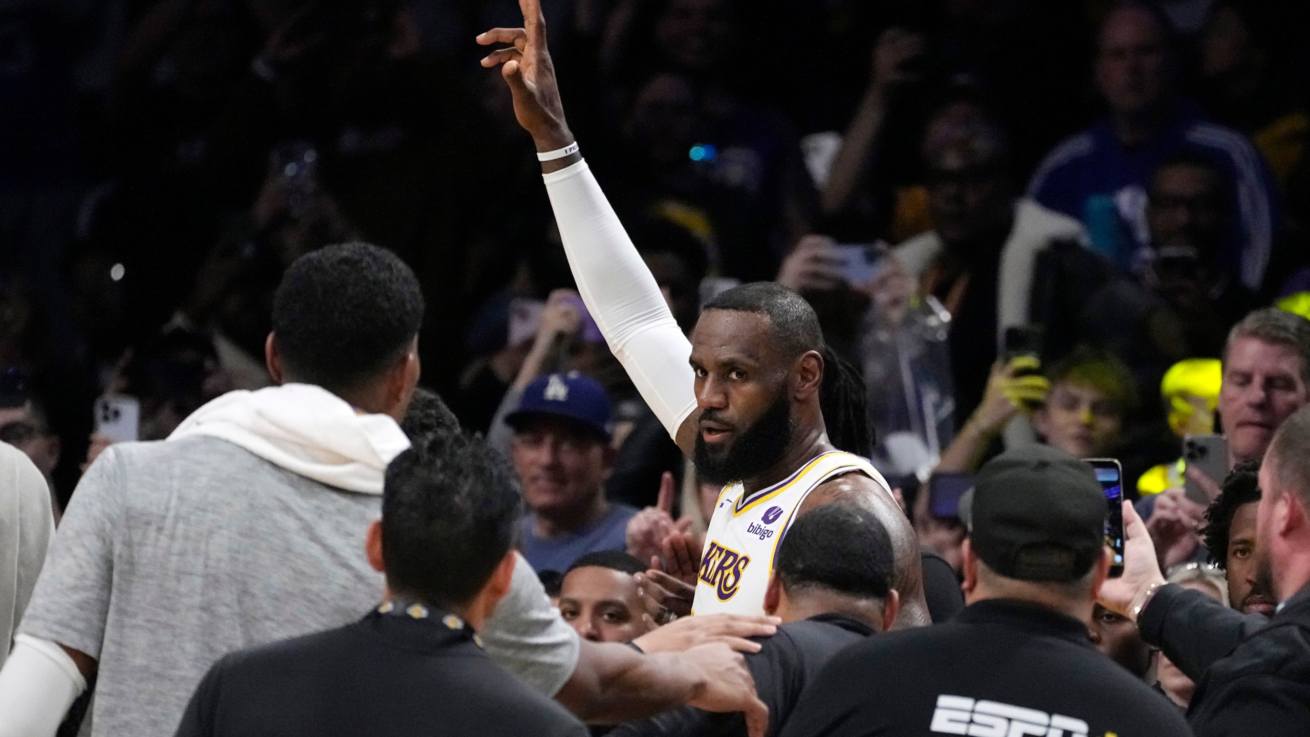 Los Angeles Lakers forward LeBron James acknowledges fans after scoring to become the first NBA player to reach 40,000 points in a career during the first half of an NBA basketball game Saturday, March 2, 2024, in Los Angeles. (AP Photo/Mark J. Terrill)