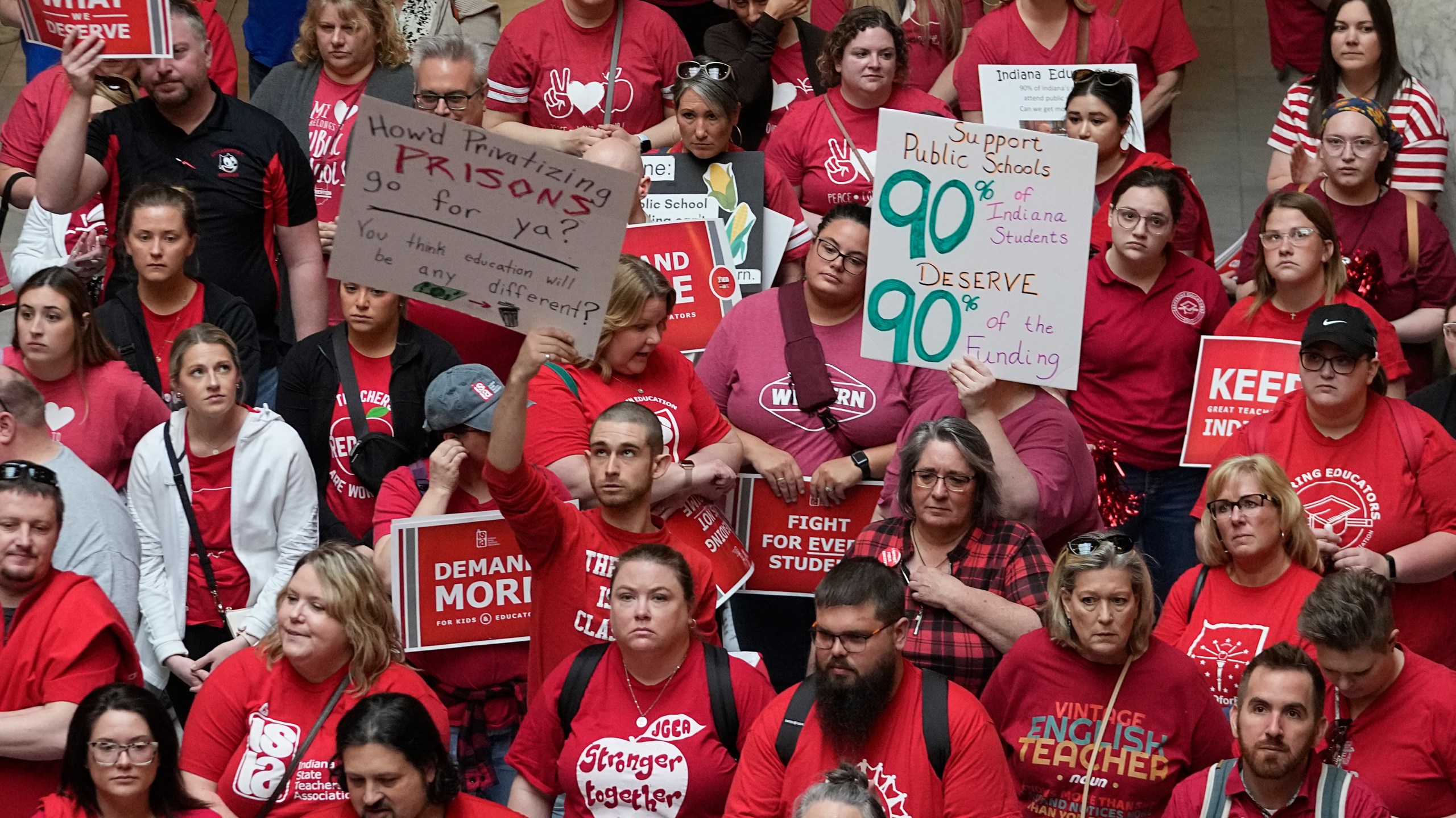 FILE - Teachers and parents attend a rally for teachers at the Statehouse in Indianapolis on Thursday, April 13, 2023. Despite their protest, Indiana joined the slate of states that expanded its programs that use taxpayer money to pay for private school tuition. (AP Photo/Darron Cummings)