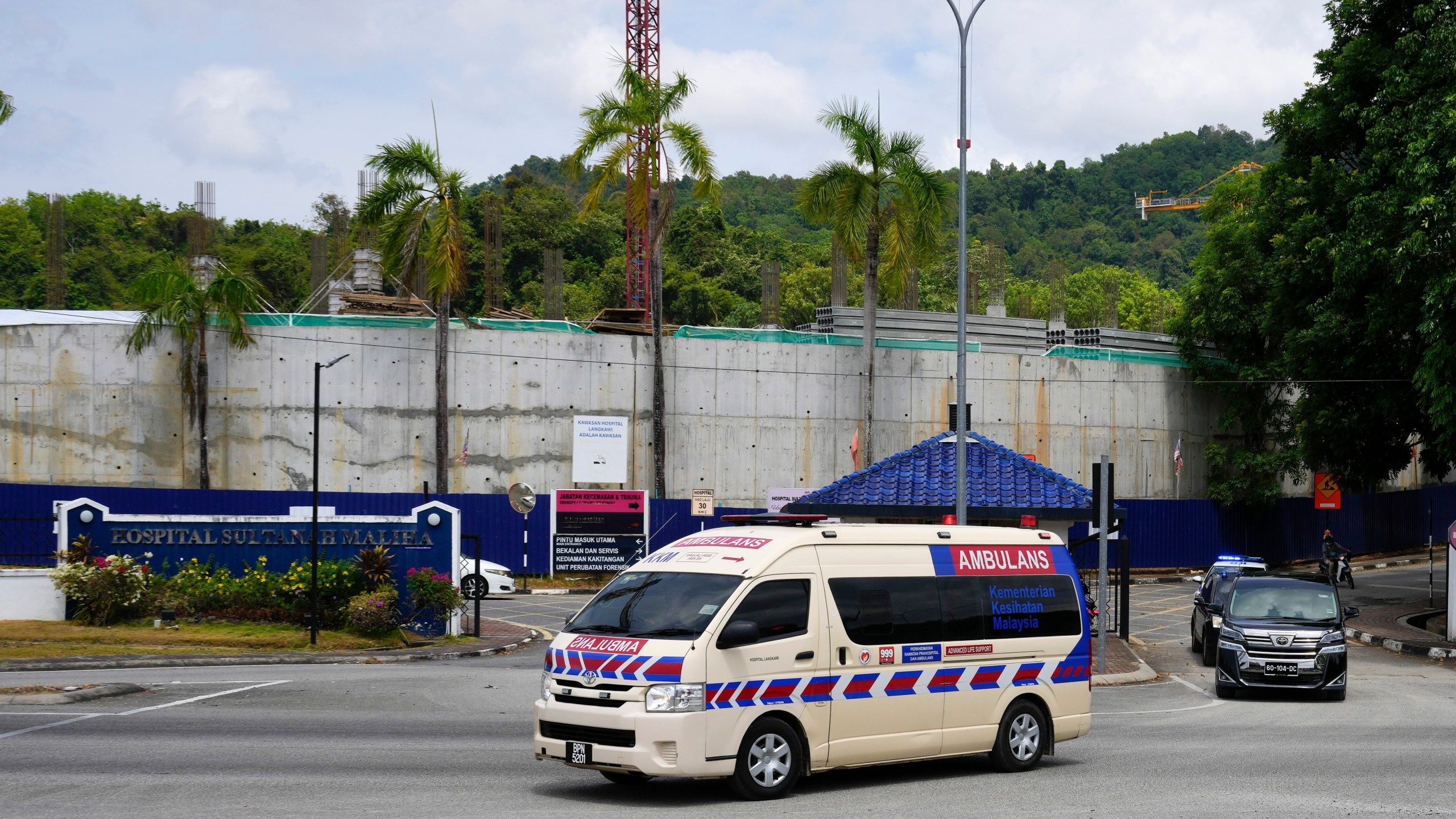 Ambulance believed to be carrying Norway's King Harald leave Sultanah Maliha Hospital, where Norway's King Harald has been admitted with an infection, on the Malaysian resort island of Langkawi, Malaysia, Sunday, March 3, 2024. (AP Photo/Vincent Thian)