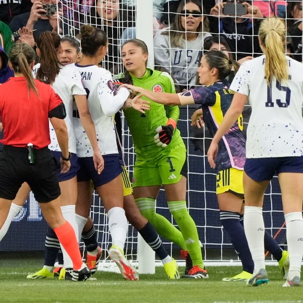 Players from the United States and Colombia get into a shoving match during the first half of a CONCACAF Gold Cup women's soccer tournament quarterfinal, Sunday, March 3, 2024, in Los Angeles. (AP Photo/Marcio Jose Sanchez)