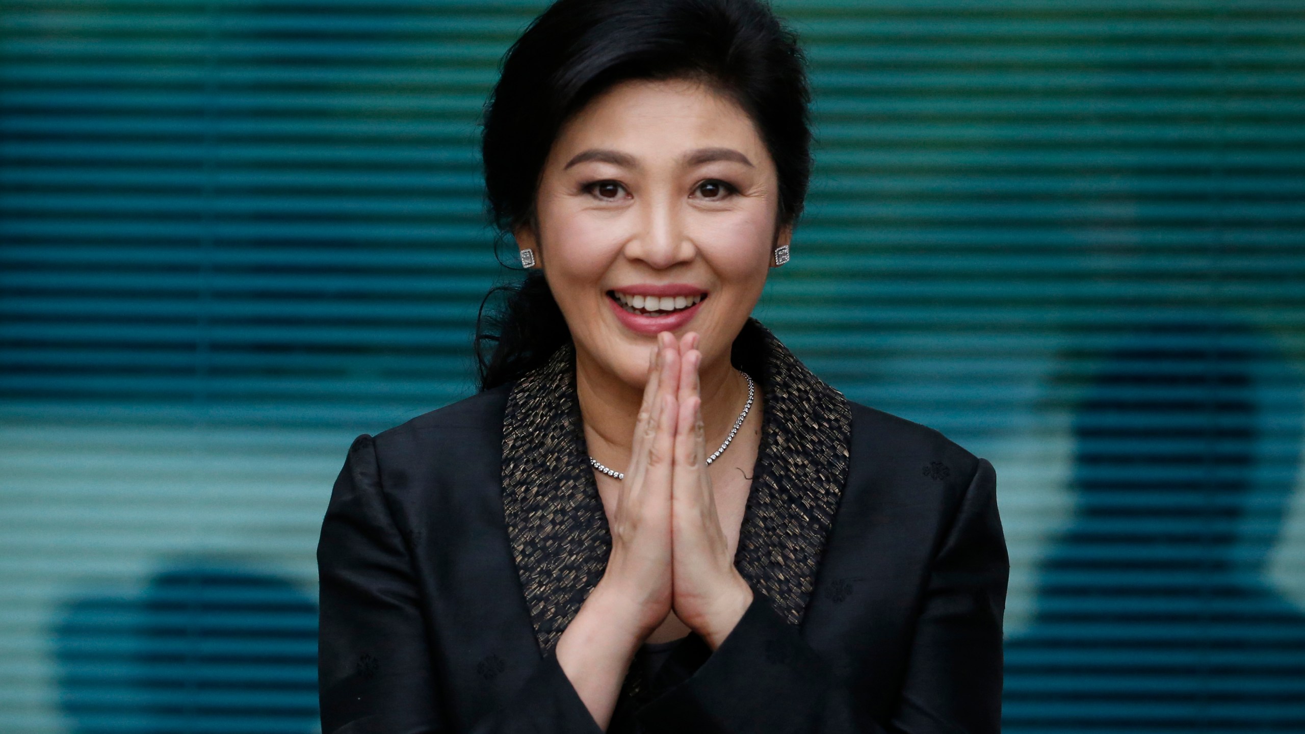 FILE - Thailand's former Prime Minister Yingluck Shinawatra arrives at the Supreme Court to make her final statements in a trial on a charge of criminal negligence in Bangkok, Thailand, on Aug. 1, 2017. A Thai court on Monday, March 4, 2024, dropped a charge against former Prime Minister Yingluck Shinawatra, now living in exile, for mishandling government project expenditure in 2013. (AP Photo/Sakchai Lalit, File)