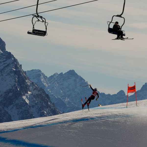 FILE - United States' Mikaela Shiffrin speeds down the course during an alpine ski, women's World Cup downhill training, in Cortina d'Ampezzo, Italy, Wednesday, Jan. 24, 2024. Mikaela Shiffrin’s return from her downhill crash is still on schedule for this weekend in Åre. (AP Photo/Alessandro Trovati, File)