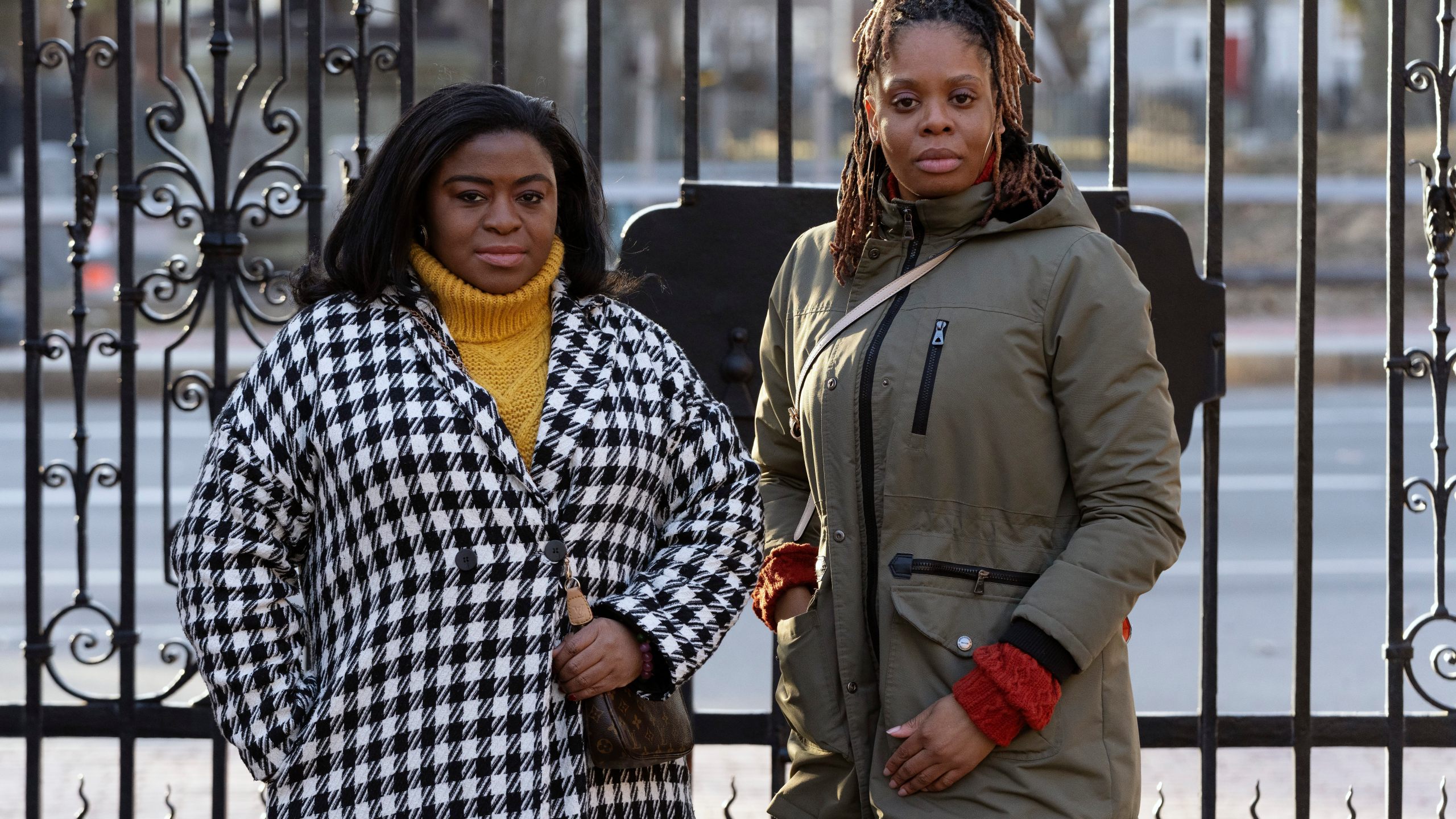 Chassity Coston, left, and Charity Wallace pose in Harvard Yard at Harvard University, Saturday, Feb. 24, 2024, in Cambridge, Mass. With attacks on diversity, equity and inclusion initiatives raging on, Black women looking to climb the work ladder are seeing a landscape that looks more hostile than ever. (AP Photo/Michael Dwyer)