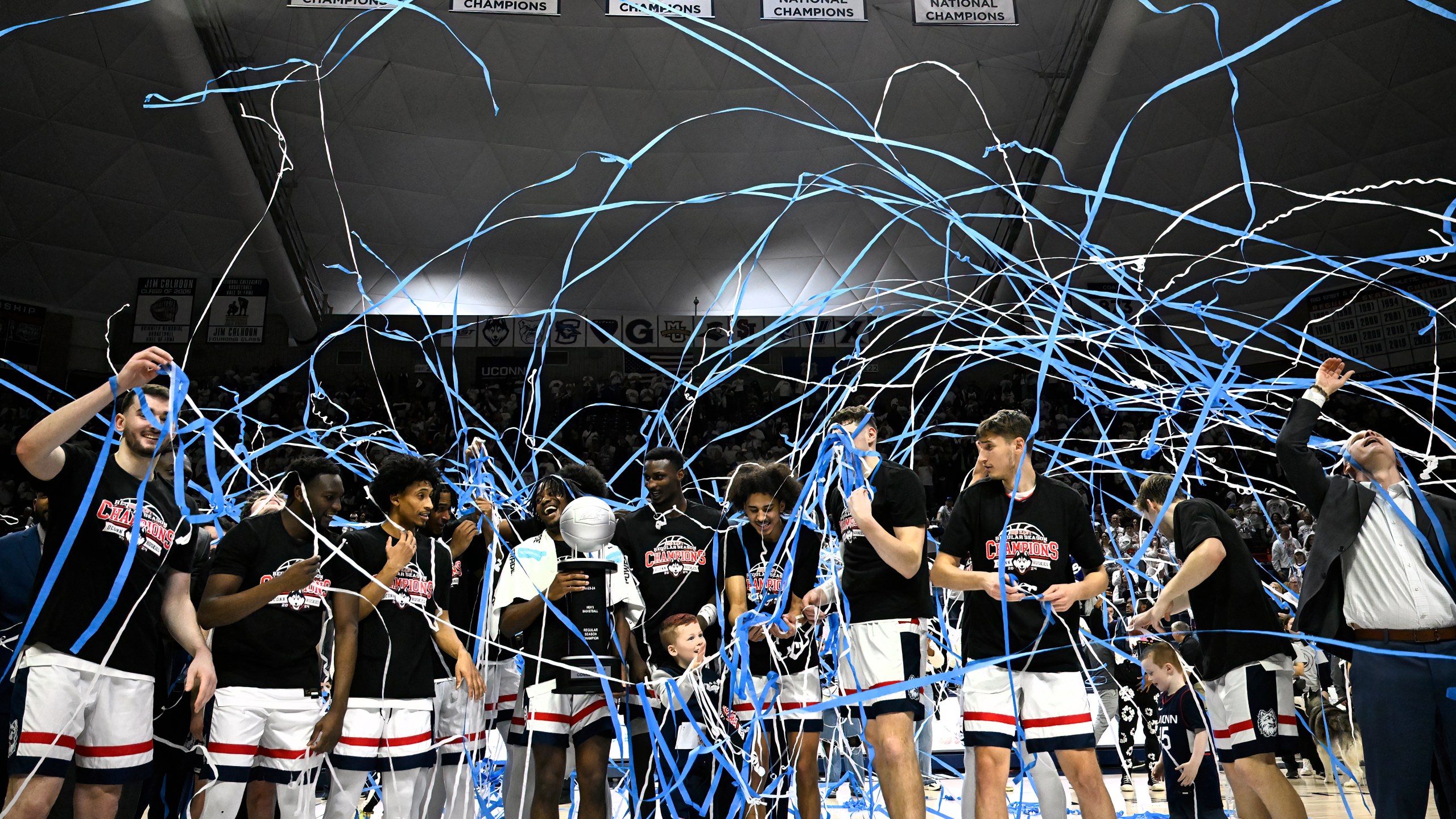 UConn celebrates winning their first outright Big East regular-season title in 25 years after an NCAA college basketball game against Seton Hall, Sunday, March 3, 2024, in Storrs, Conn. (AP Photo/Jessica Hill)