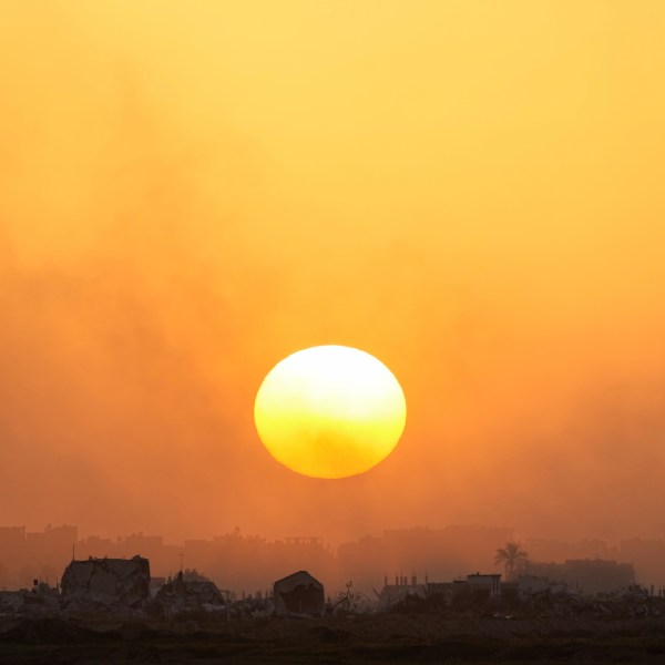 The sun sets over the Gaza Strip as seen from southern Israel, Monday, March 4, 2024. (AP Photo/Ohad Zwigenberg)