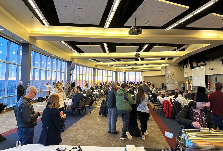 Republican presidential caucusgoers gather after voting at the caucus site, Monday, March 4, 2024, at Bismarck State College in Bismarck, N.D. Gov. Doug Burgum spoke virtually on behalf of former President Donald Trump. Former U.N. Ambassador Nikki Haley and Florida businessman David Stuckenberg also addressed caucusgoers remotely. (AP Photo/Jack Dura)