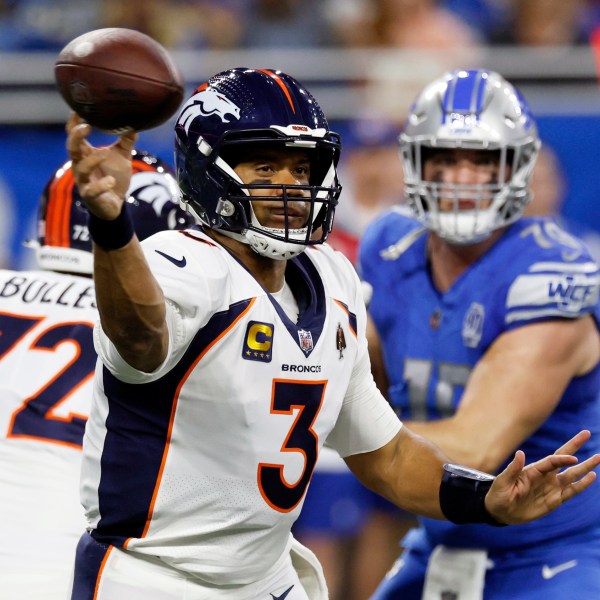 FILE - Denver Broncos quarterback Russell Wilson (3) throws during the first half of an NFL football game against the Detroit Lions, Dec. 16, 2023, in Detroit. The Broncos told Wilson, Monday, March 4, 2024, that they are going to release him next week, just 18 months after signing the Super Bowl-winning quarterback to a five-year, $242 million contract extension. (AP Photo/Duane Burleson, File)