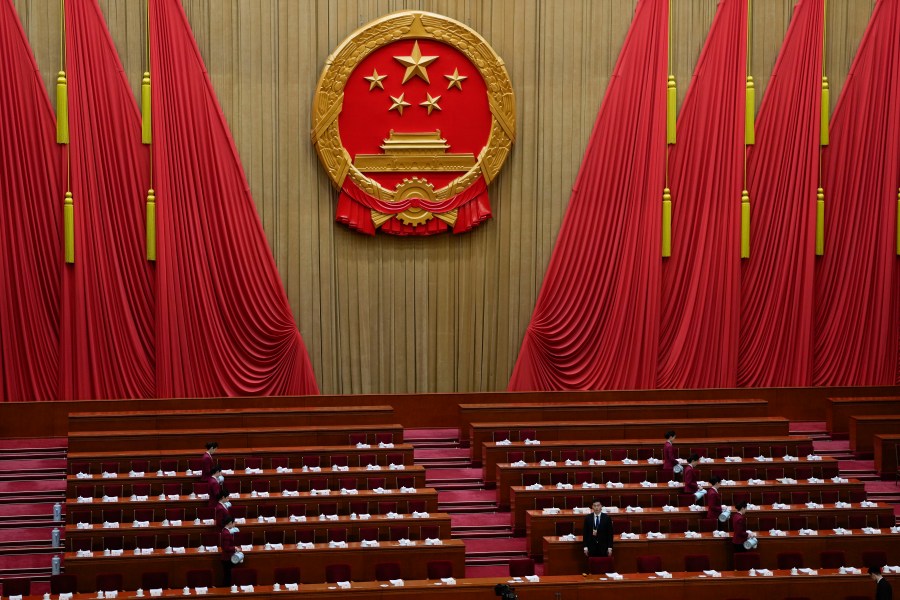 A member of security looks on before the opening session of the The National People's Congress (NPC) at the Great Hall of the People in Beijing, China, Tuesday, March 5, 2024. (AP Photo/Ng Han Guan)