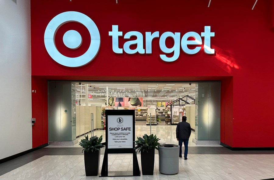 FILE - A person heads into a Target store Thursday, Jan. 11, 2024, in Lakewood, Colo. The company is slated to announce fourth-quarter financial results on Tuesday, March 5, 2024, hours before it holds its annual meeting with investors and analysts. The results and executive comments should offer more clues on shopper behavior in a still tough economic environment. (AP Photo/David Zalubowski, File)