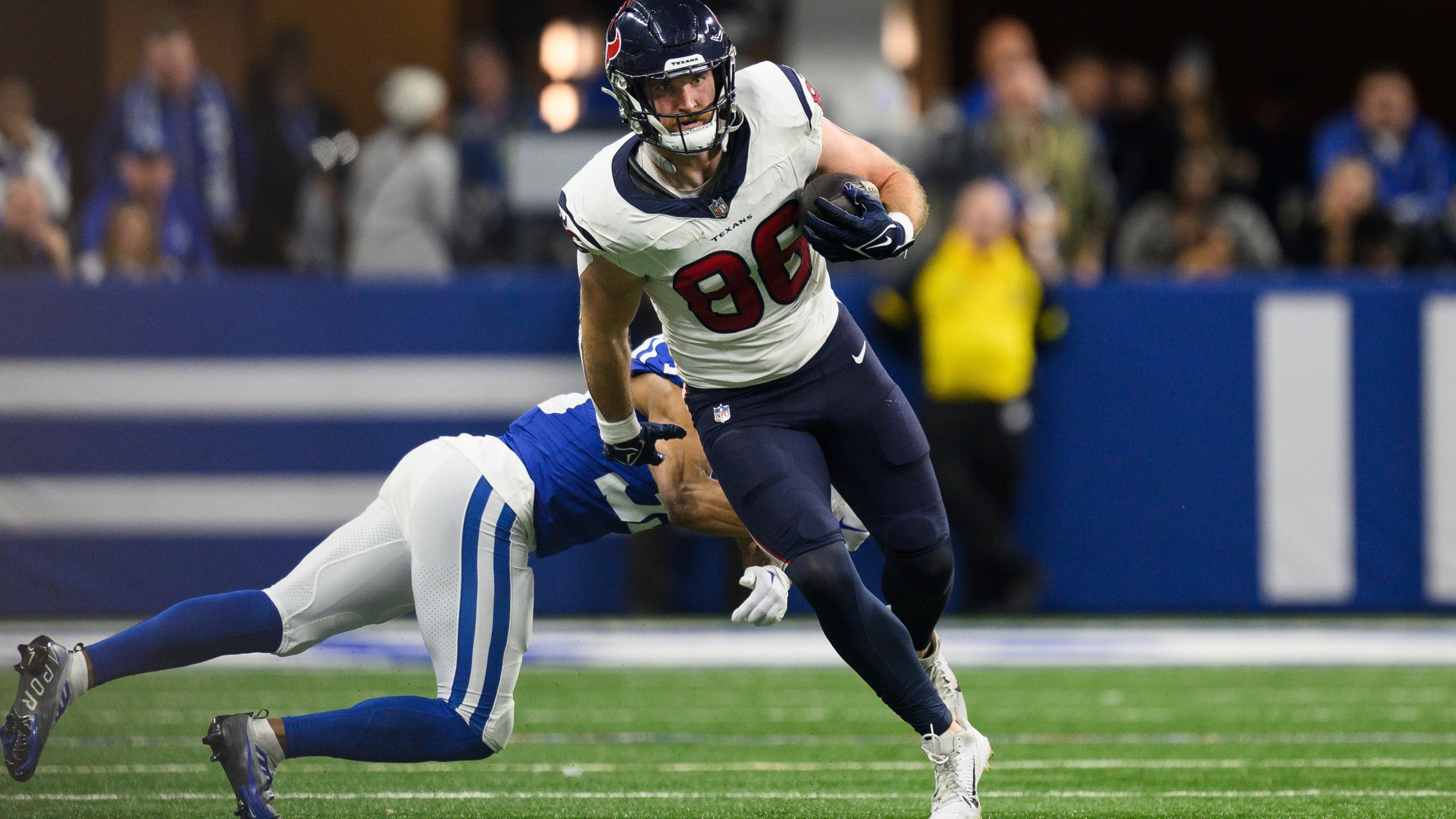 FILE - Houston Texans tight end Dalton Schultz (86) runs through the tackle of Indianapolis Colts cornerback Darrell Baker Jr. (39) during an NFL football game, Saturday, Jan. 6, 2024, in Indianapolis. Houston signed Schultz to a one-year, $6.25 million deal and got 59 catches for 635 yards and five TDs in the regular season and another TD in the playoffs. (AP Photo/Zach Bolinger, File)