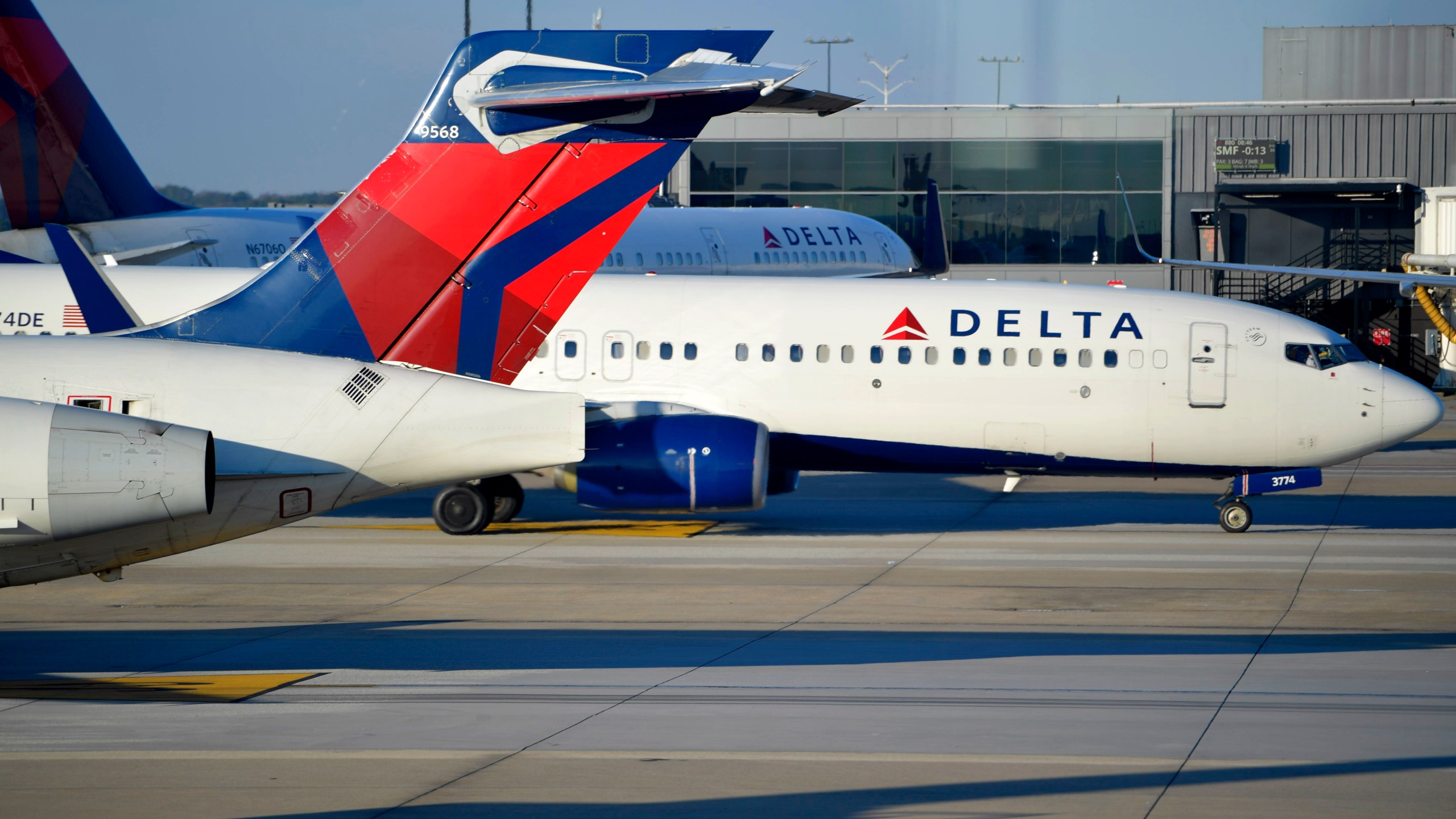 FILE - A Delta Airlines aircraft taxi's, Thursday, Dec. 2, 2021, at Hartsfield-Jackson Atlanta International Airport, in Atlanta. Delta Airlines has just boosted the cost of your first checked bag by 17%. (AP Photo/Mike Stewart, File)