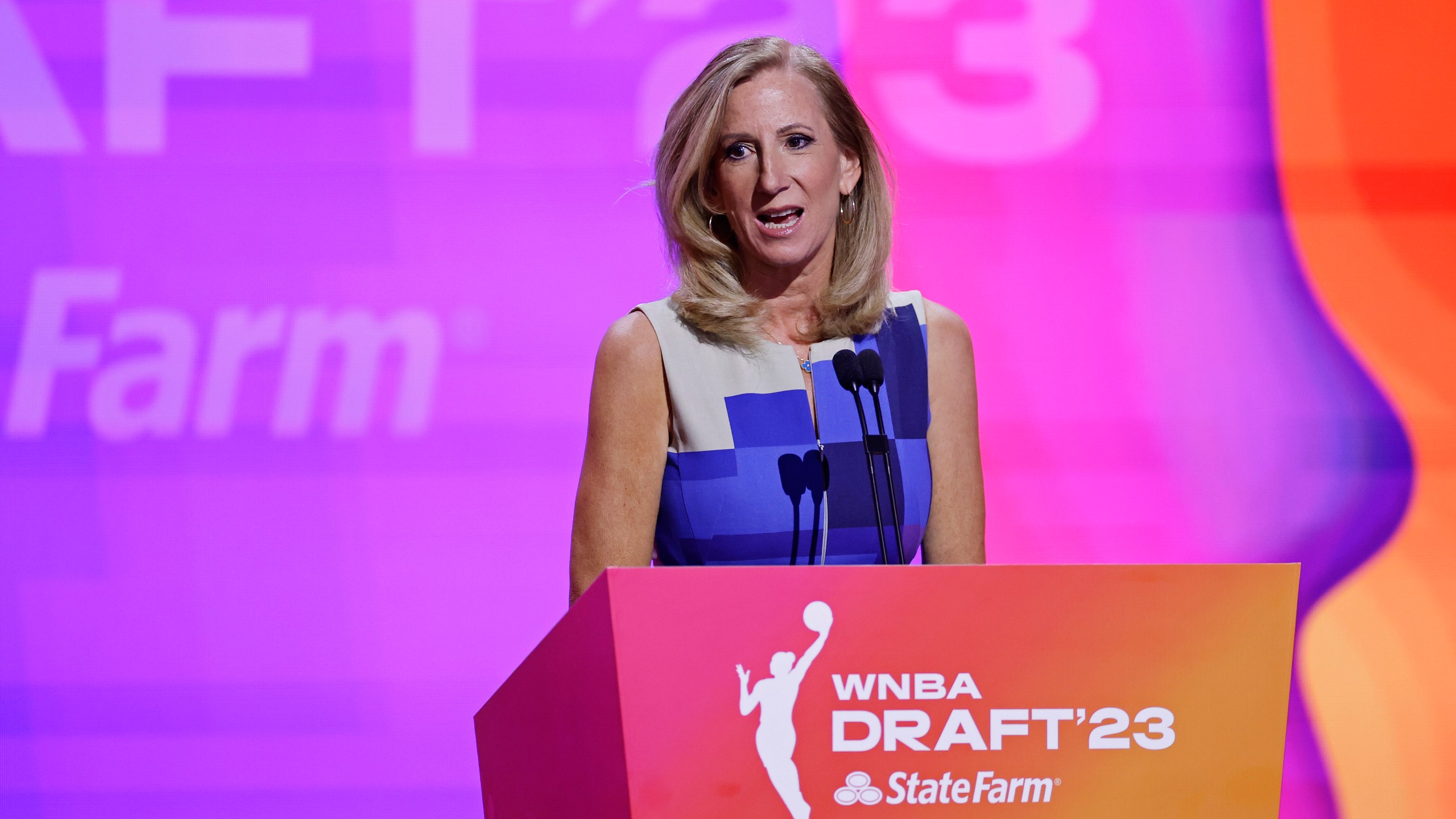 FILE - Commissioner Cathy Engelbert speaks at the WNBA basketball draft Monday, April 10, 2023, in New York. The WNBA Draft will have a new home this year and for the first time in eight seasons have the space for 1,000 fans to attend. “We are focused on creating elevated events that WNBA fans won’t want to miss, at a time when the energy for the WNBA has never been higher,” Engelbert said.(AP Photo/Adam Hunger, File)