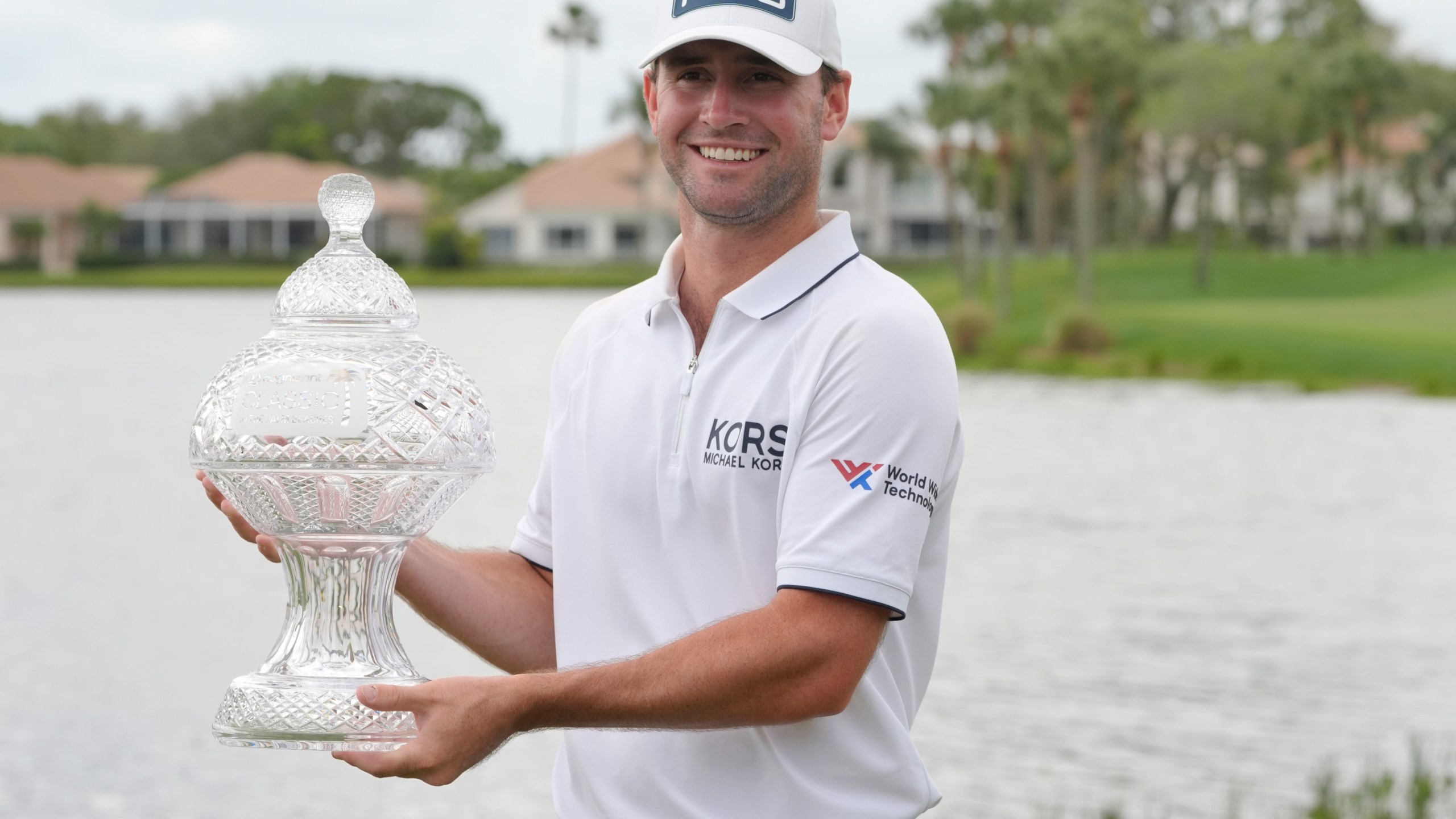 Austin Eckroat holds the Cognizant Classic trophy after the golf tournament, Monday, March 4, 2024, in Palm Beach Gardens, Fla. Eckroat got the first victory of his tour career Monday, topping Erik van Rooyen and Min Woo Lee by three shots to win the weather-delayed Cognizant Classic. (AP Photo/Marta Lavandier)