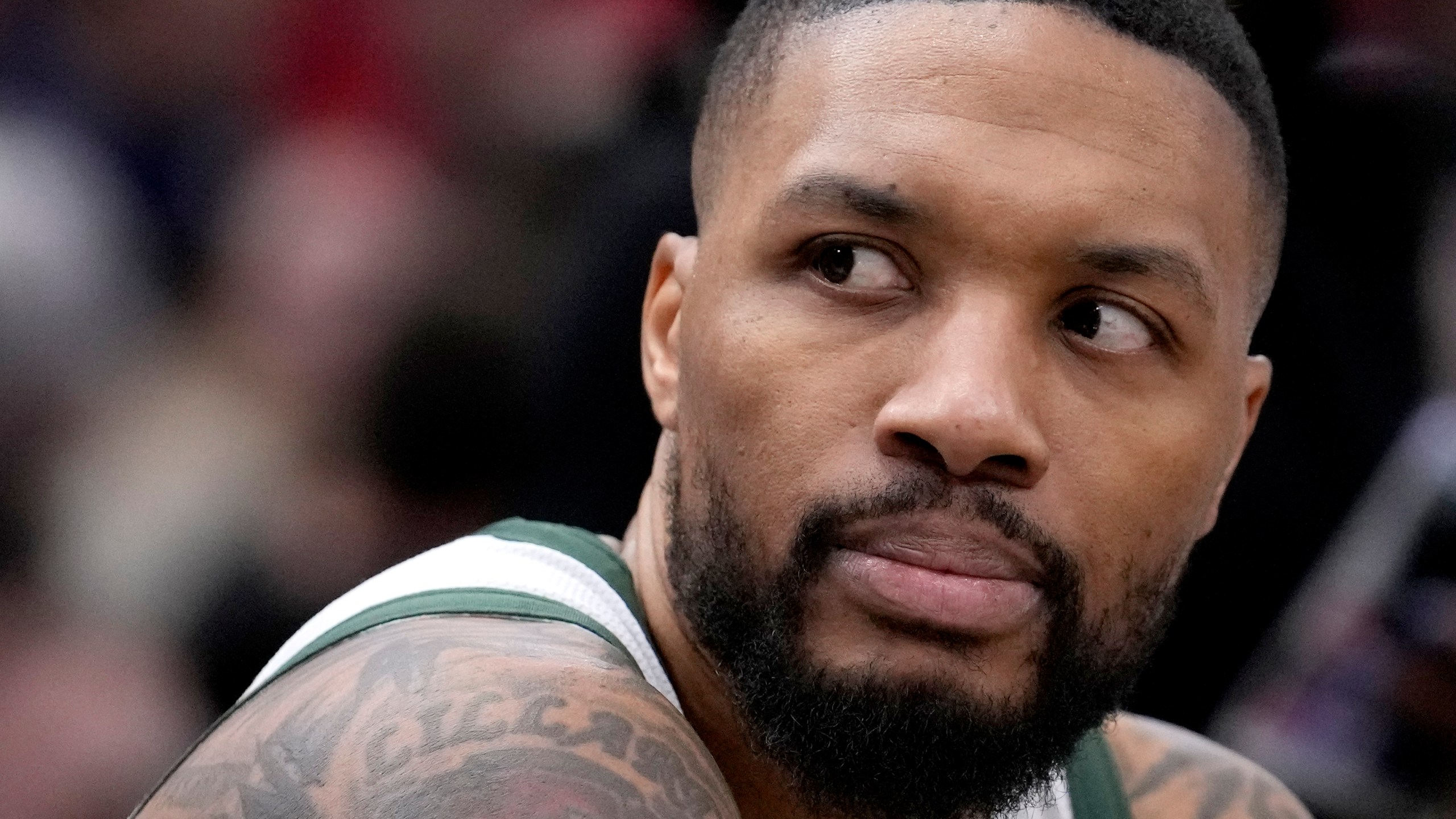 Milwaukee Bucks' Damian Lillard looks down the bench during a time out in an NBA basketball game against the Chicago Bulls Friday, March 1, 2024, in Chicago. (AP Photo/Charles Rex Arbogast)