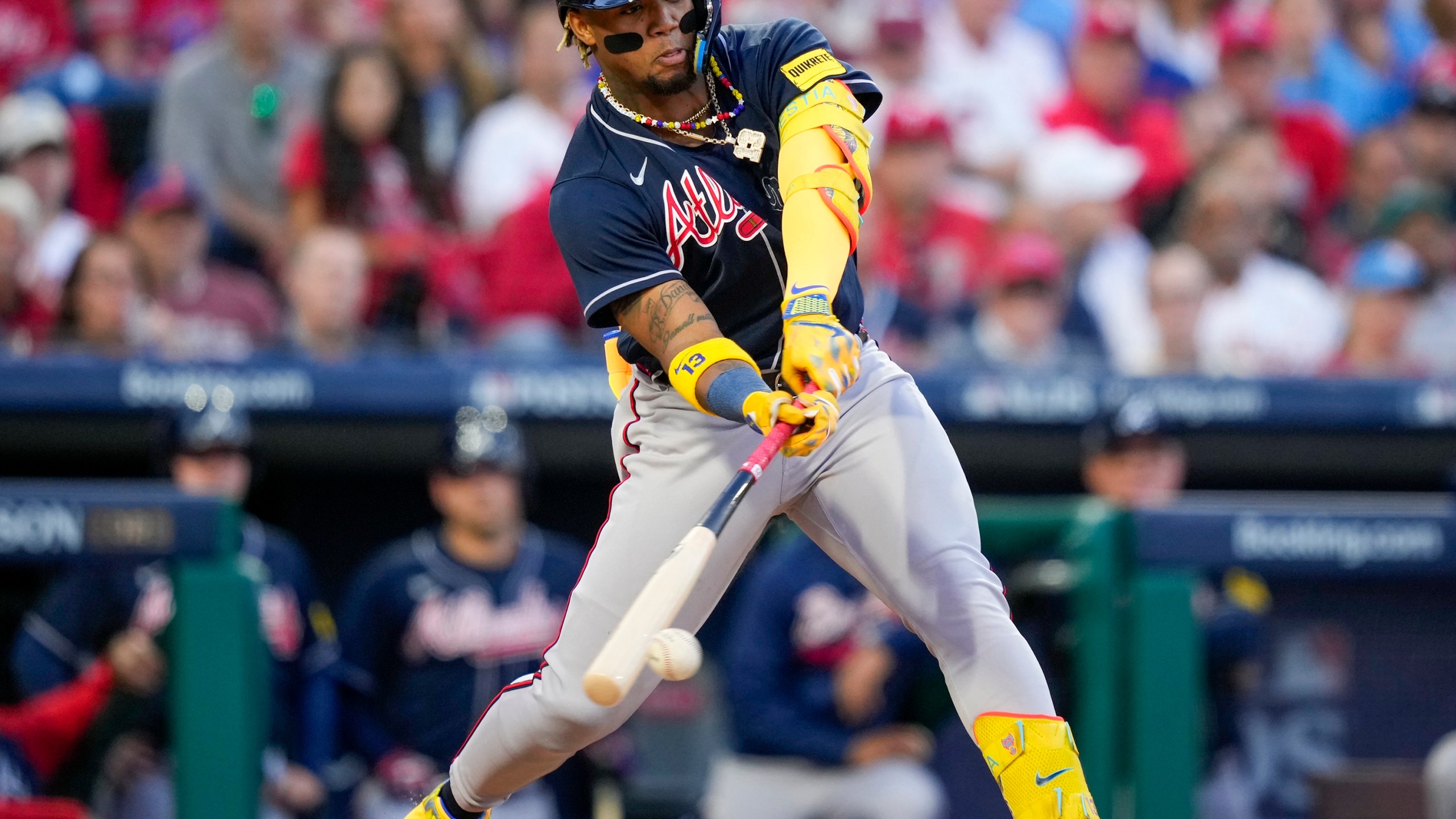 FILE - Atlanta Braves' Ronald Acuna Jr. hits a double during the third inning of Game 3 of a baseball NL Division Series against the Philadelphia Phillies, Oct. 11, 2023, in Philadelphia. This season, the Braves and stars like Acuna will try to finish the job after a disappointing early exit in last year's playoffs. (AP Photo/Matt Slocum, File)