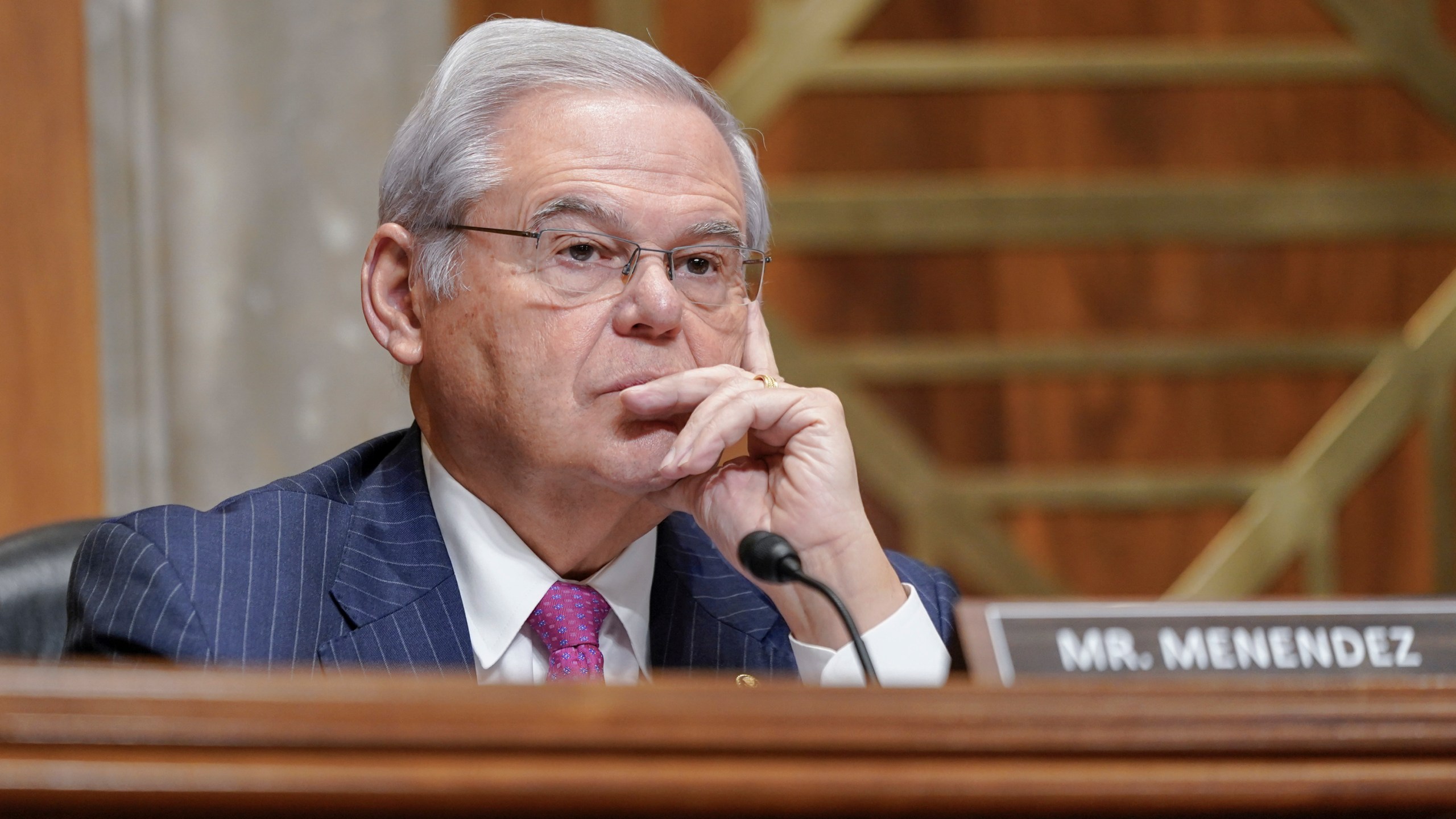 FILE - Sen. Bob Menendez, D-N.J., listens during a Senate Foreign Relations Committee, Thursday, Dec. 7, 2023, in Washington. New obstruction of justice crimes were added Tuesday, March 5, 2024, to charges against Menendez and his wife that allege they accepted gold bars, cash and a luxury car in return for favors the senator carried out to assist three businessmen. Both have pleaded not guilty. (AP Photo/Mariam Zuhaib, File)