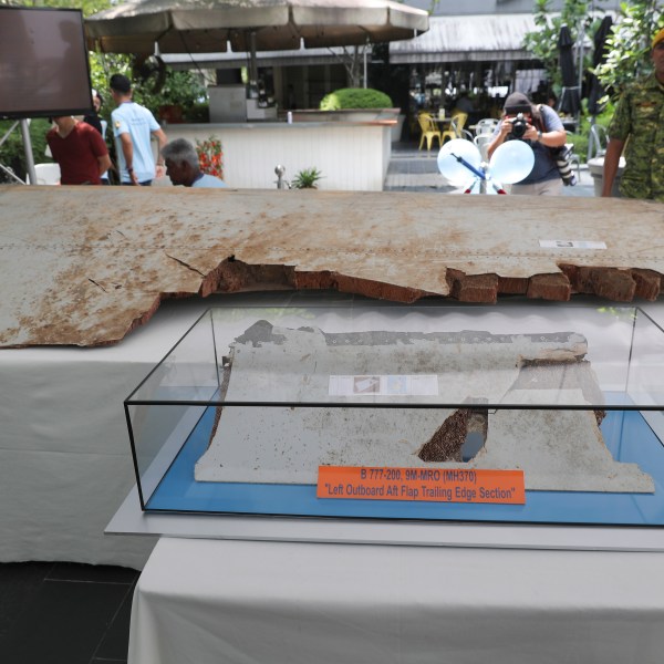 Debris from the missing Malaysia Airlines Flight MH370 is displayed.