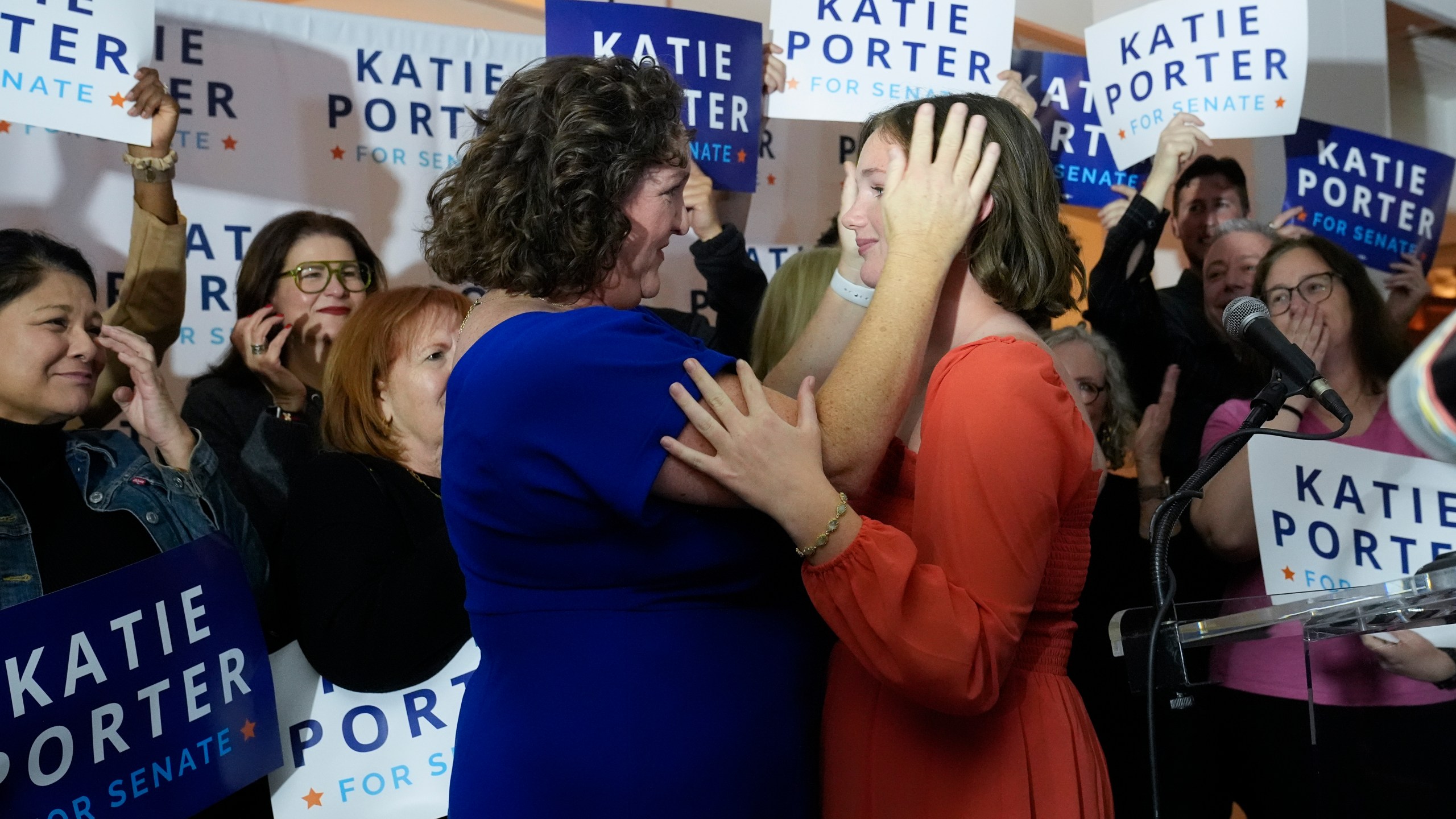 U.S. Rep. Katie Porter, D-Calif., left, a U.S. Senate candidate, embraces her daughter Betsy at an election night party, Tuesday, March 5, 2024, in Long Beach, Calif. (AP Photo/Damian Dovarganes)