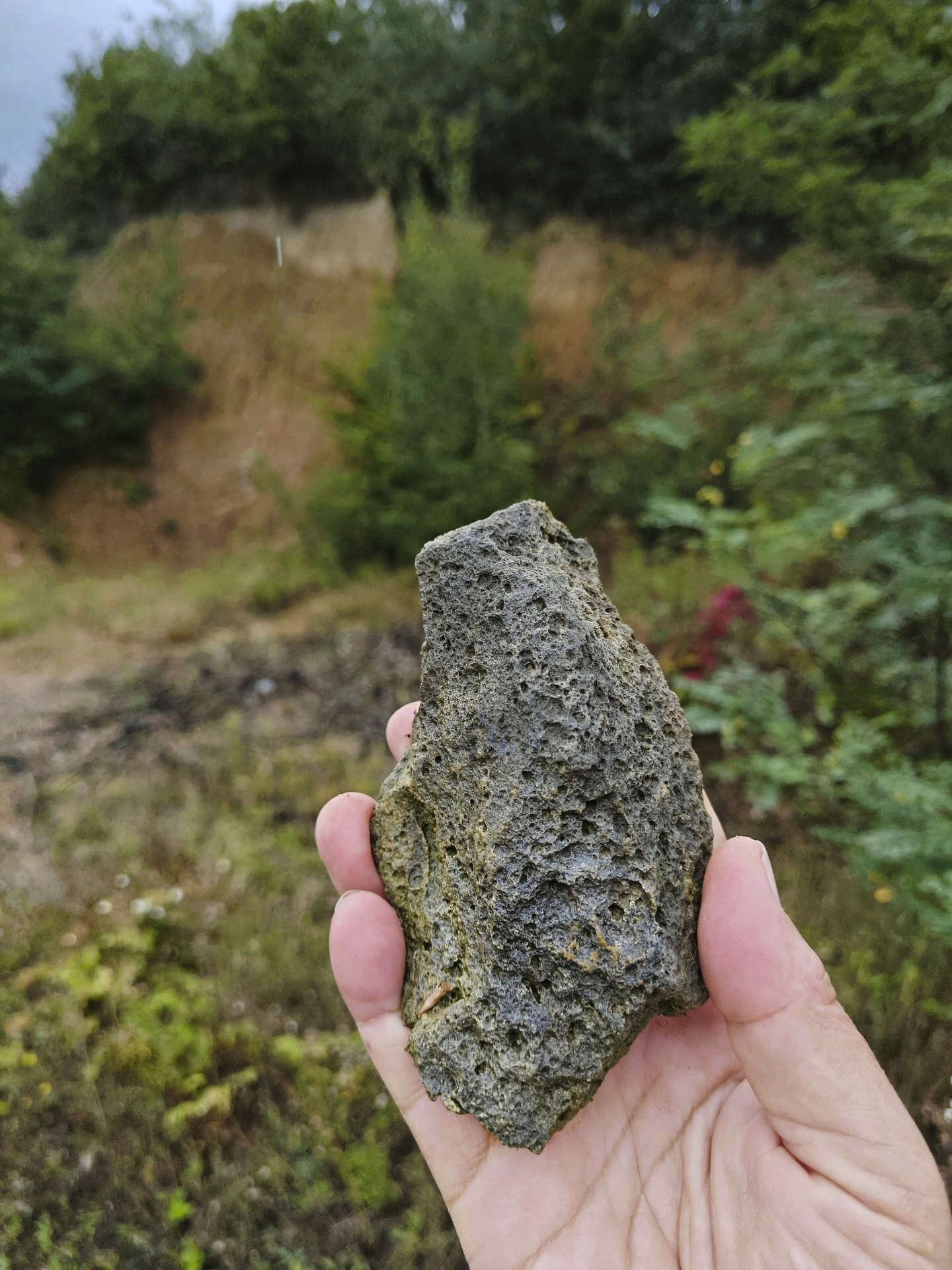 This photo provided by researcher Roman Garba shows a notched stone tool made from local volcanic raw material (glassy dacite) at the Korolevo I archaeological site in western Ukraine in August 2023. Stone tools found in the area are the earliest evidence of early human presence in Europe, dating back to 1.4 million years ago, according to research published in the journal Nature on Wednesday, March 6, 2024. (Roman Garba via AP)