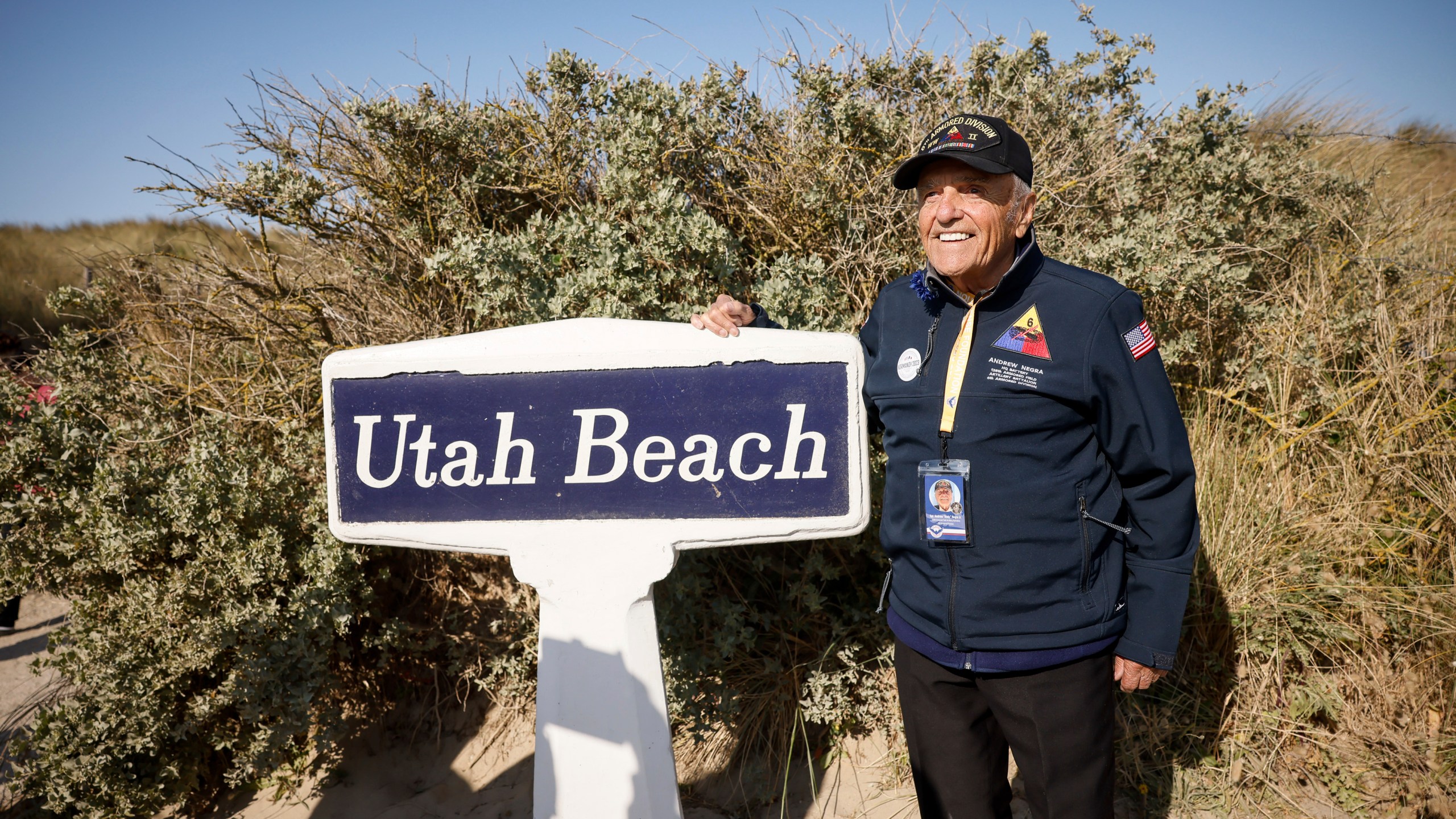 FILE - U.S. veteran Andrew Negra poses for a photo after the commemoration organized by the Best Defense Foundation at Utah Beach near Sainte-Marie-du-Mont, Normandy, France, Sunday, June 4, 2023, ahead of the D-Day Anniversary. French President Emmanuel Macron on Wednesday March 6, 2024 called on the public to collect photos, films, personal journals and testimony from witnesses to liberation at the end of World War Two, as the country prepares to mark the 80th anniversary of the Normandy landings which heralded the beginning of the end for Nazi Germany. (AP Photo/Thomas Padilla, File)