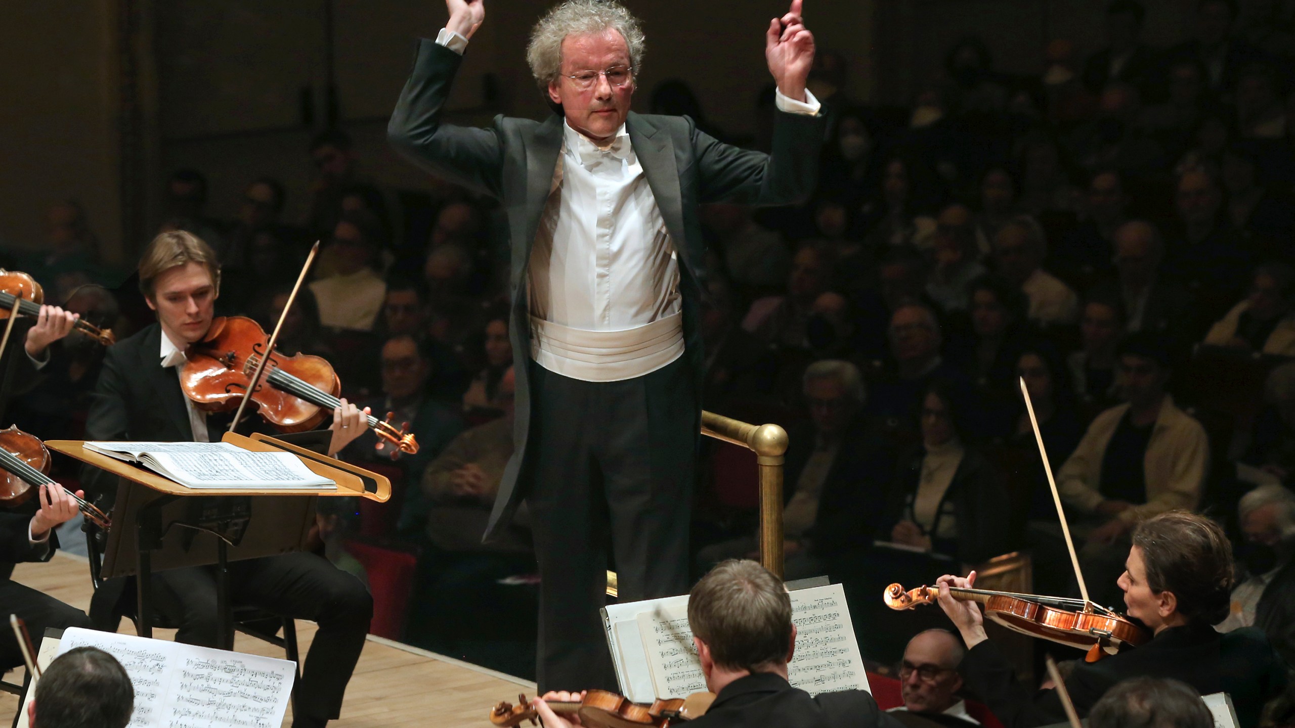 This image released by Carnegie Hall shows conductor Franz Welser-Möst , center, and Albena Danailova, background right, during a performance by the Vienna Philharmonic at Carnegie Hall in New York on March 3, 2024. Vienna Philharmonic has 24 female players among 145 members with three vacancies as it tours the United States this week. (Steve J. Sherman/Carnegie Hall via AP)