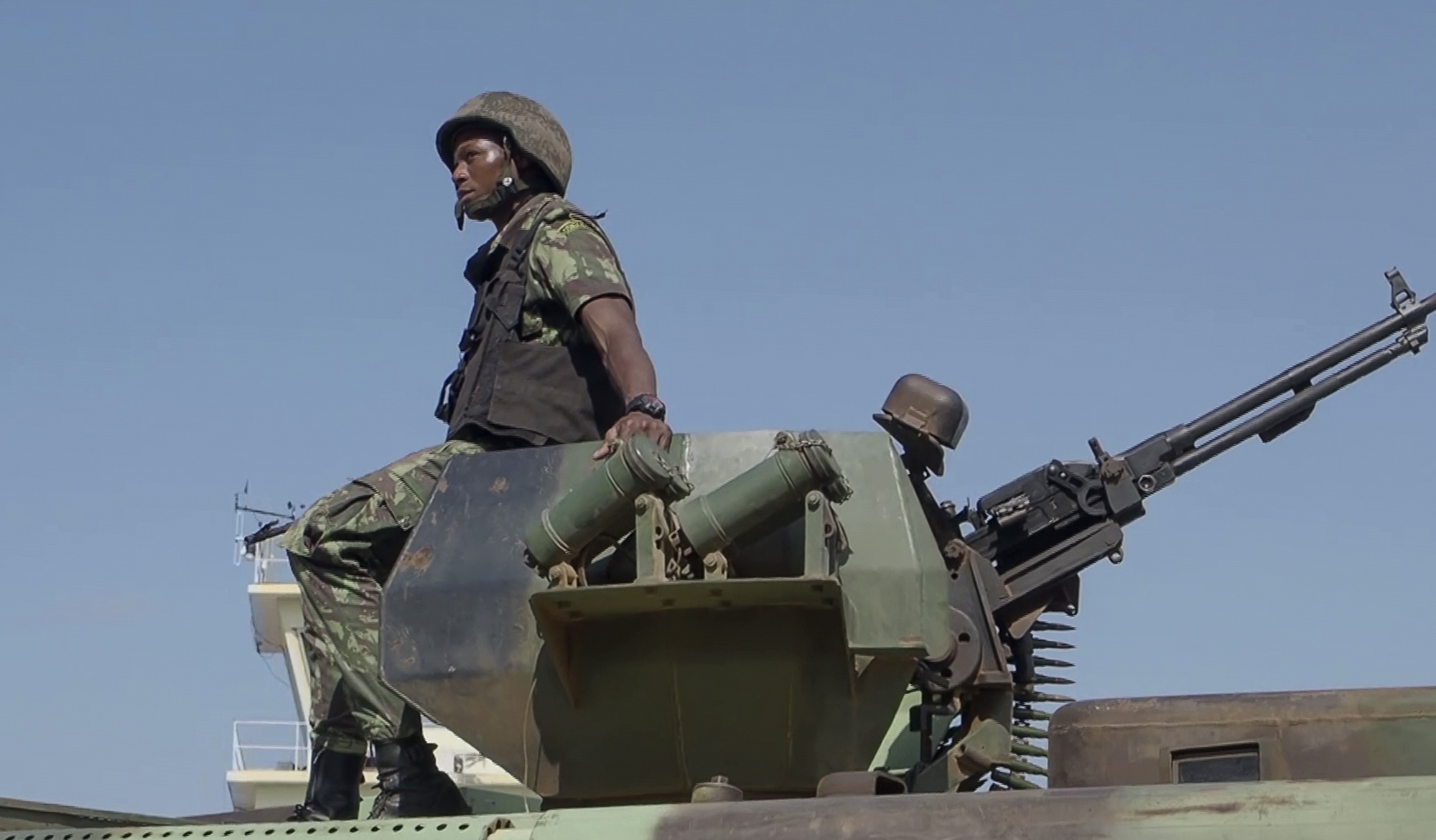 FILE - In this image made from video, a Mozambican soldier rides on an armored vehicle at the airport in Mocimboa da Praia, Cabo Delgado province, Mozambique, Aug. 9, 2021. Aid agencies and local authorities say a surge of new attacks by an Islamic State-affiliated group in northern Mozambique has left more than 70 children missing and caused 100,000 people to flee their homes. There are fears the children may have drowned in a river or been kidnapped by militants, the aids groups said in a report on Wednesday March 6, 2024. (AP Photo/Marc Hoogsteyns, File)
