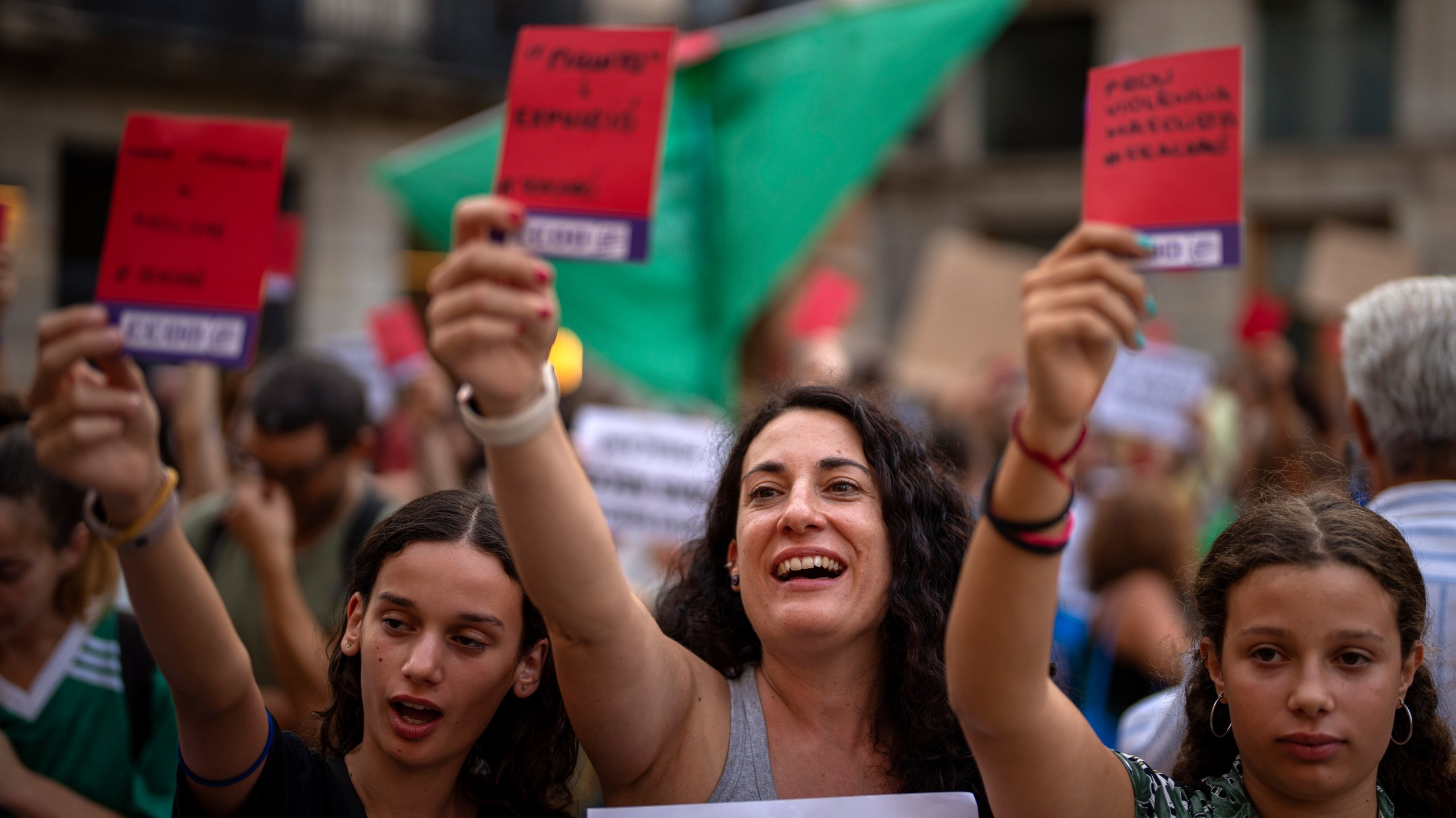 FILE - Demonstrators shouts slogans during a protest against the President of Spain's soccer federation Luis Rubiales and to support Spain's national women's soccer player Jenni Hermoso in Barcelona, Spain, Monday, Sept. 4, 2023. The Spanish soccer federation and Barcelona soccer club have been fined an undisclosed sum by Spain’s labor ministry for not meeting workplace regulations regarding gender equality. The ministry says that the federation did not have the required gender equality plan or sexual harassment protocols in place when Spain won last year's Women's World Cup. (AP Photo/Emilio Morenatti, File)