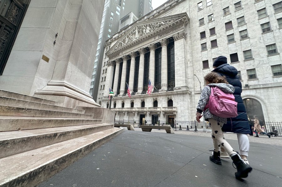 People pass the New York Stock Exchange on Wednesday, March 6, 2024, in New York. World shares are mostly higher after tumbling Big Tech stocks dragged Wall Street to its worst day in three weeks. (AP Photo/Peter Morgan)