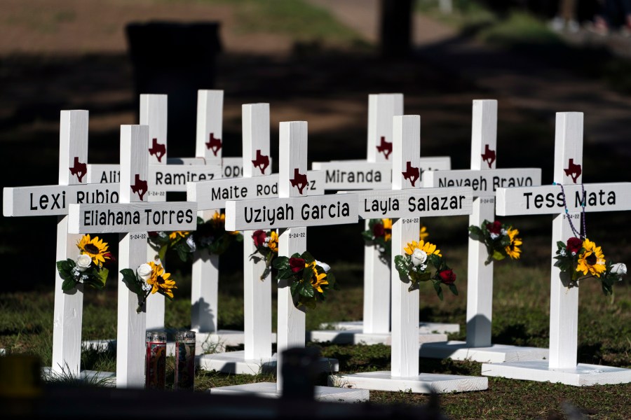 FILE - Crosses with the names of shooting victims are placed outside Robb Elementary School in Uvalde, Texas, May 26, 2022. Nearly two years after the deadly school shooting in Uvalde that left 19 children and two teachers dead, the city council will discuss Thursday, March 7, 2024, the results of an independent investigation it requested into the response by local police officers. (AP Photo/Jae C. Hong, File)