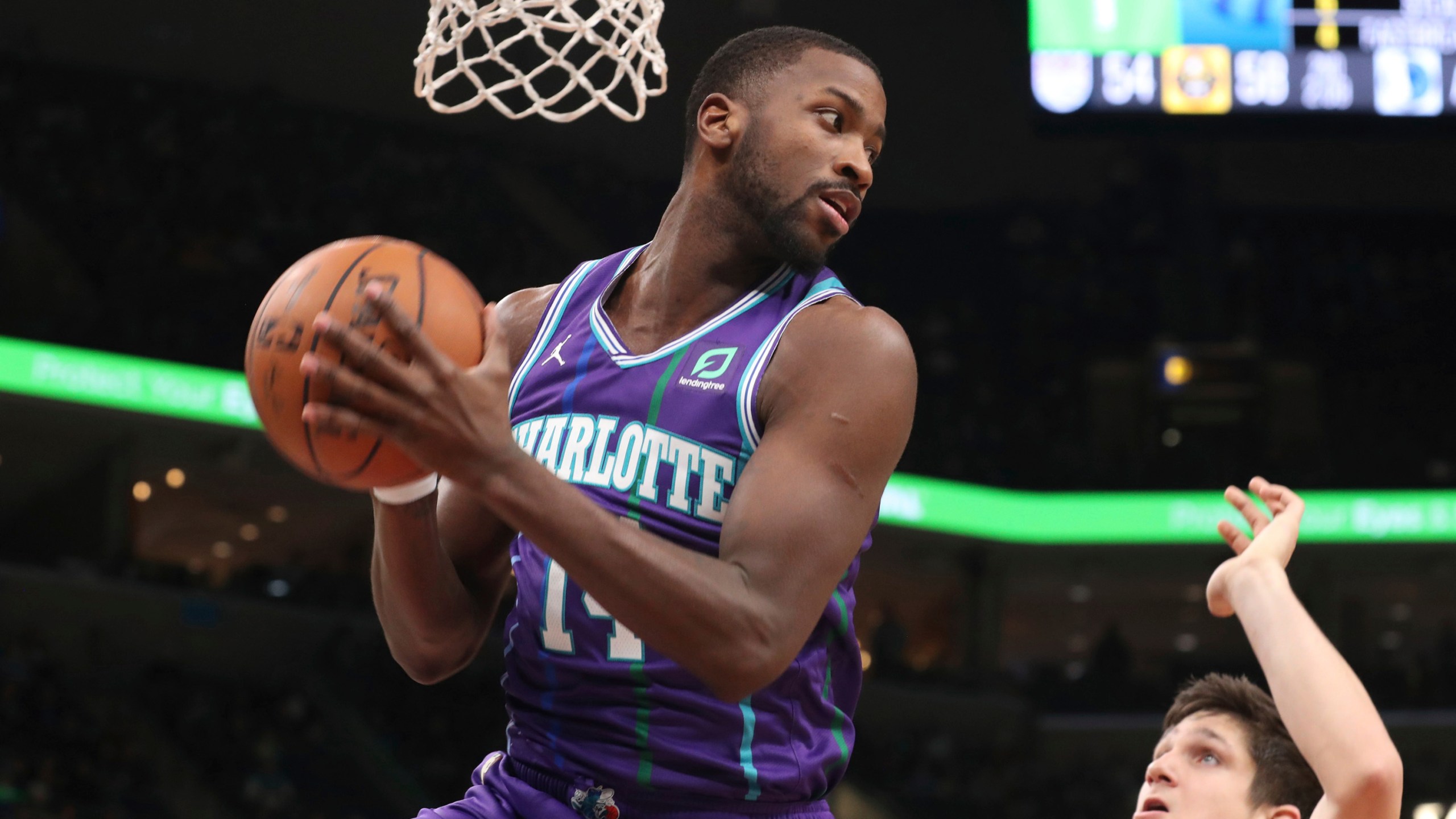 FILE - Charlotte Hornets forward Michael Kidd-Gilchrist (14) grabs a rebound in the first half of an NBA basketball game against the Memphis Grizzlies, Dec. 29, 2019, in Memphis, Tenn. The Kentucky Senate voted, Thursday, March 7, 2024, to expand insurance coverage for people seeking treatment for stuttering, and the bill's sponsor credited the former basketball star with the assist. (AP Photo/Karen Pulfer Focht, File)