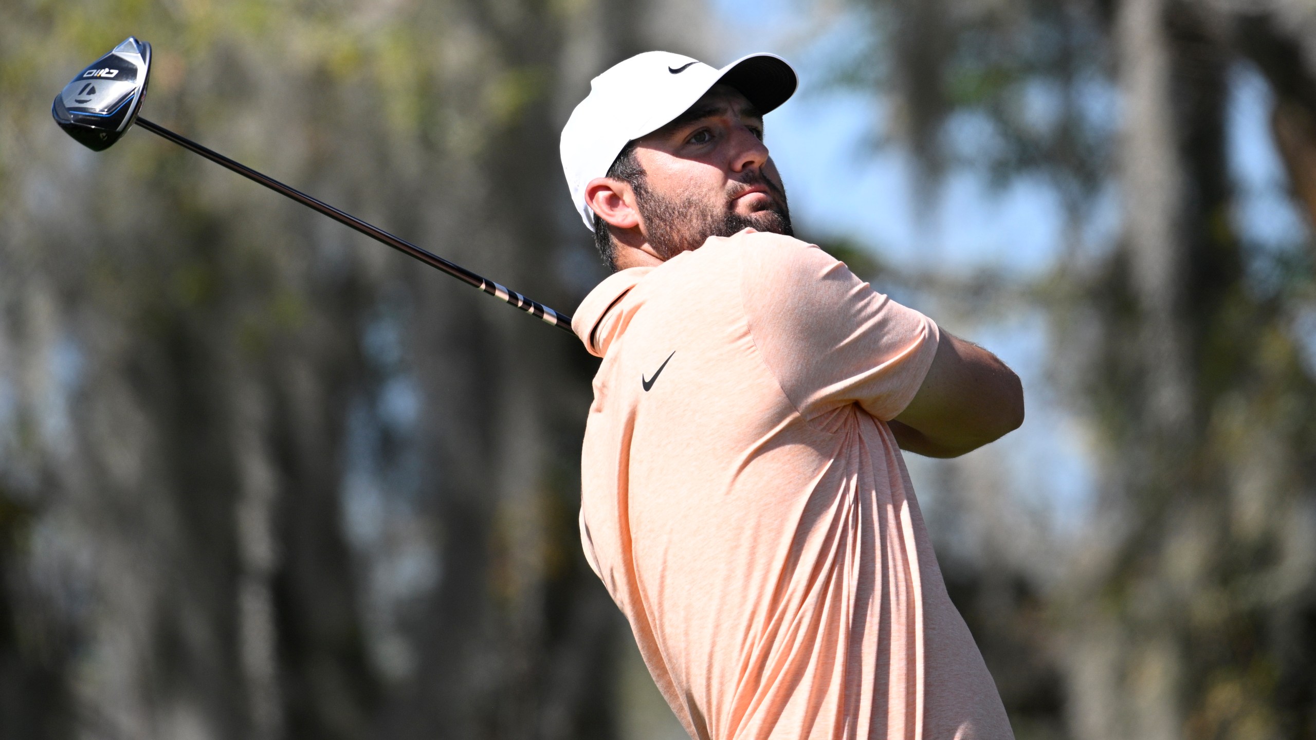 Scottie Scheffler tees off on the third hole during the first round of the Arnold Palmer Invitational golf tournament, Thursday, March 7, 2024, in Orlando, Fla. (AP Photo/Phelan M. Ebenhack)