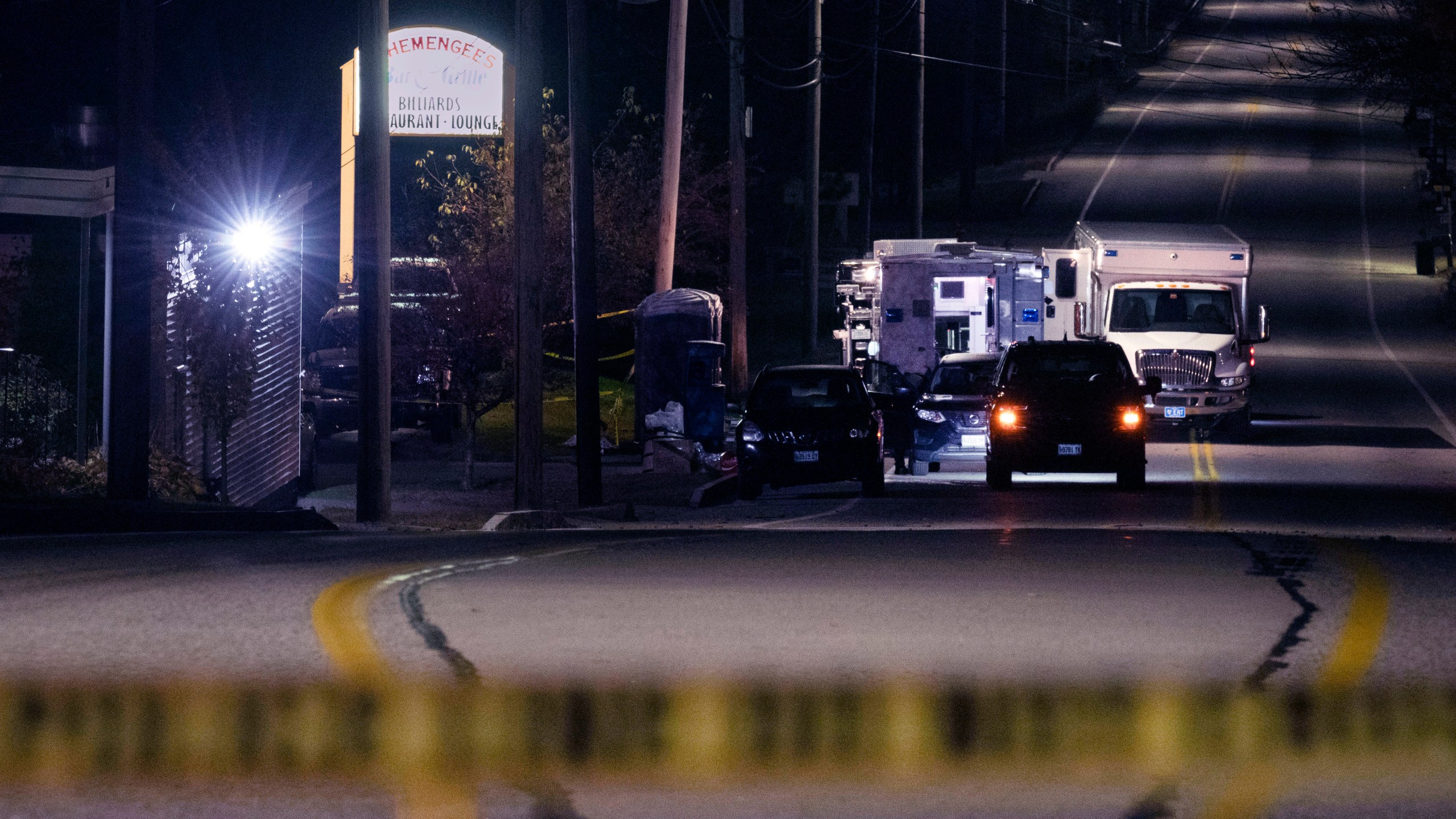 FILE - Police tape cordons off the road to Schemengees Bar and Grille as law enforcement officers maintain their presence in the aftermath of a mass shooting by Army reservist Robert Card in Lewiston, Maine, Oct. 27, 2023. Army officials will testify Thursday, March 7, 2024 before a special commission investigating the deadliest mass shooting in Maine history, which was committed by a former reservist. (AP Photo/Matt Rourke, File)