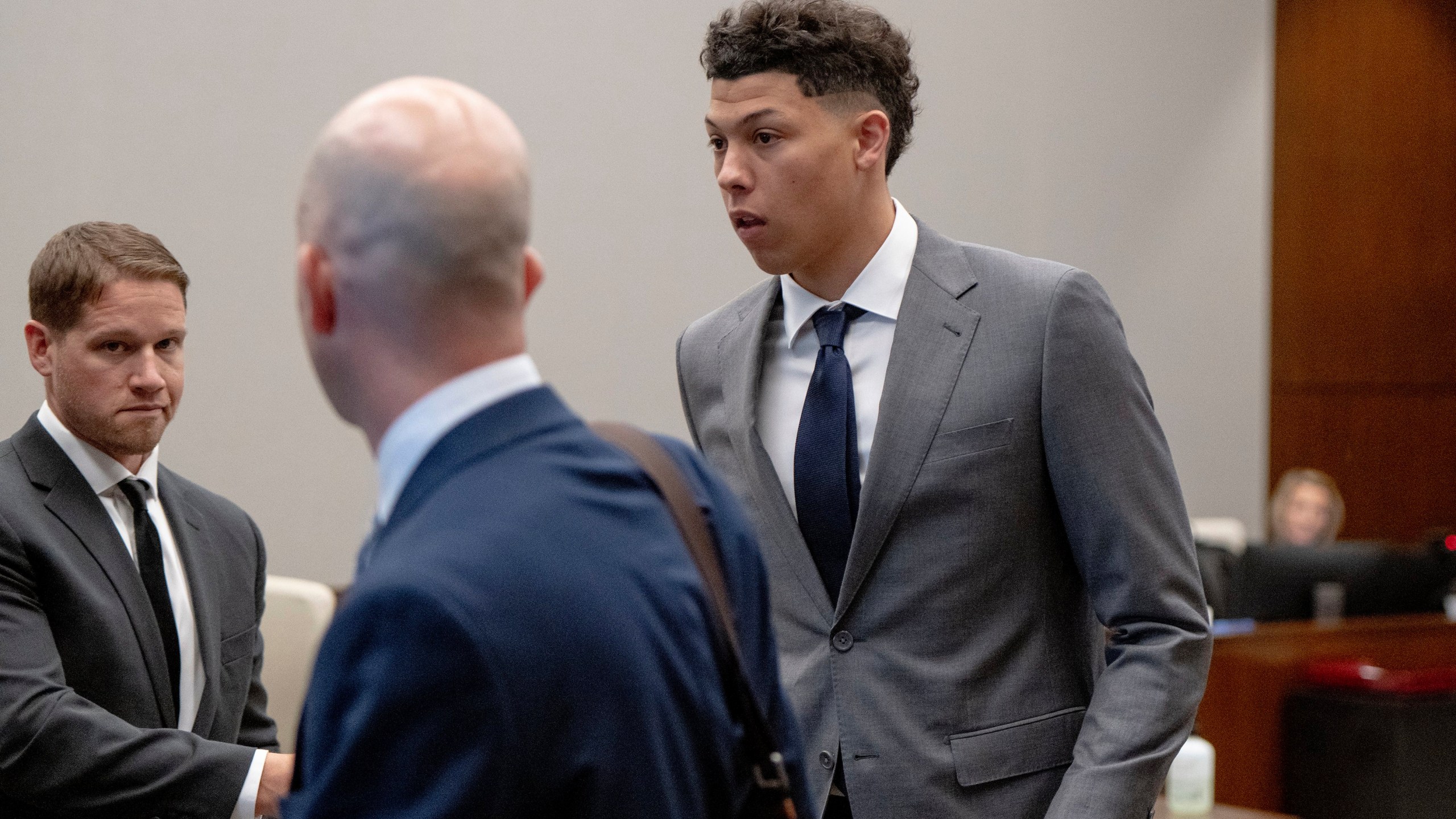 FILE - Jackson Mahomes, right, leaves the courtroom following a bond motion hearing in Johnson County District Court, May 16, 2023, in Olathe, Kan. The younger brother of Super Bowl-winning Kansas City Chiefs quarterback Patrick Mahomes has been sentenced to six months' probation in a case alleging an assault on a woman. Jackson Mahomes, 23, appeared Thursday, March 7, 2024, for his sentencing hearing via video conference and pleaded guilty to a single misdemeanor count of battery, according to online court records. (Nick Wagner/The Kansas City Star via AP, File)