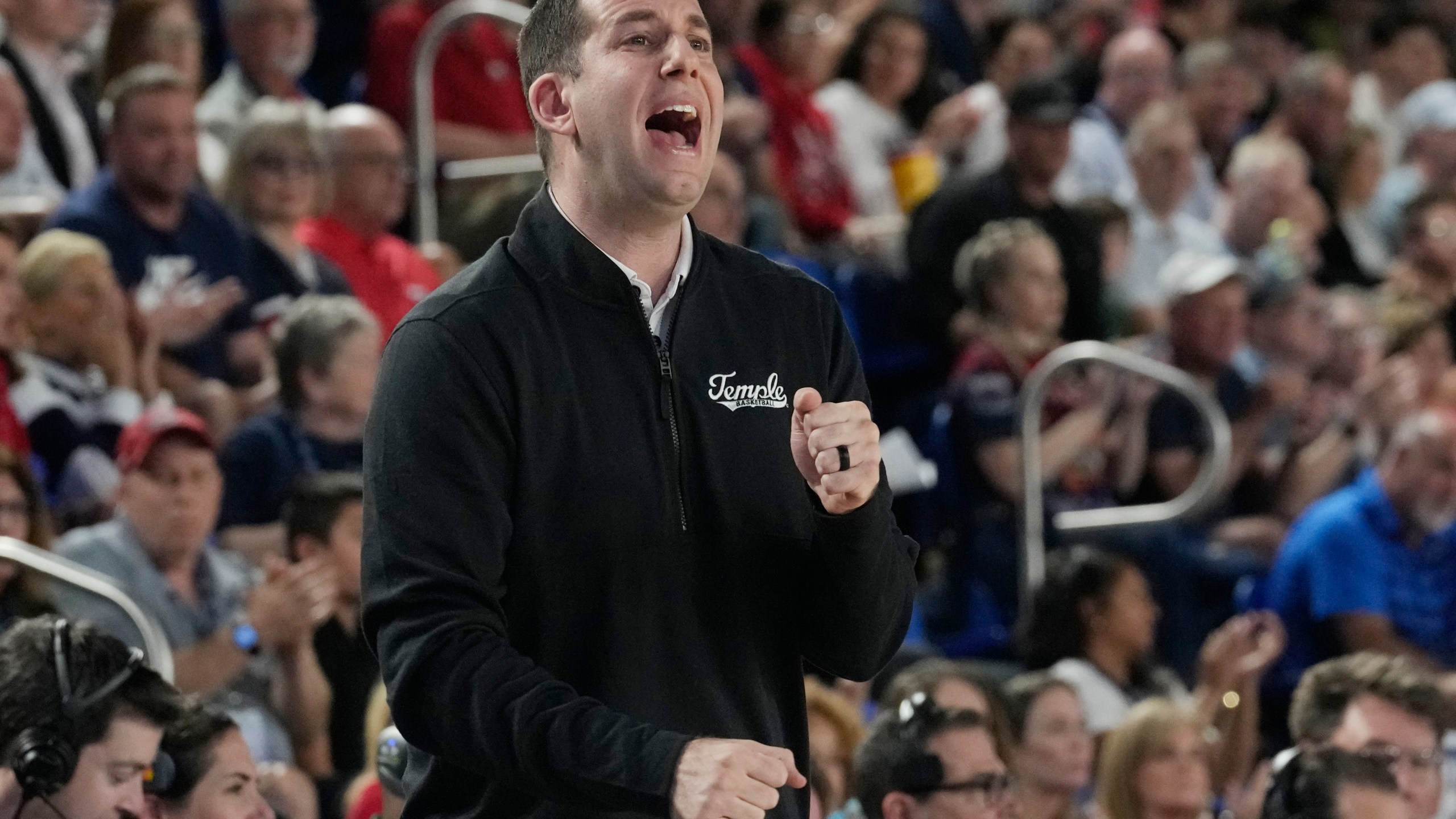 Temple head coach Adam Fisher gestures during the first half of an NCAA college basketball game against Florida Atlantic , Thursday, Feb. 15, 2024, in Boca Raton, Fla. (AP Photo/Marta Lavandier)