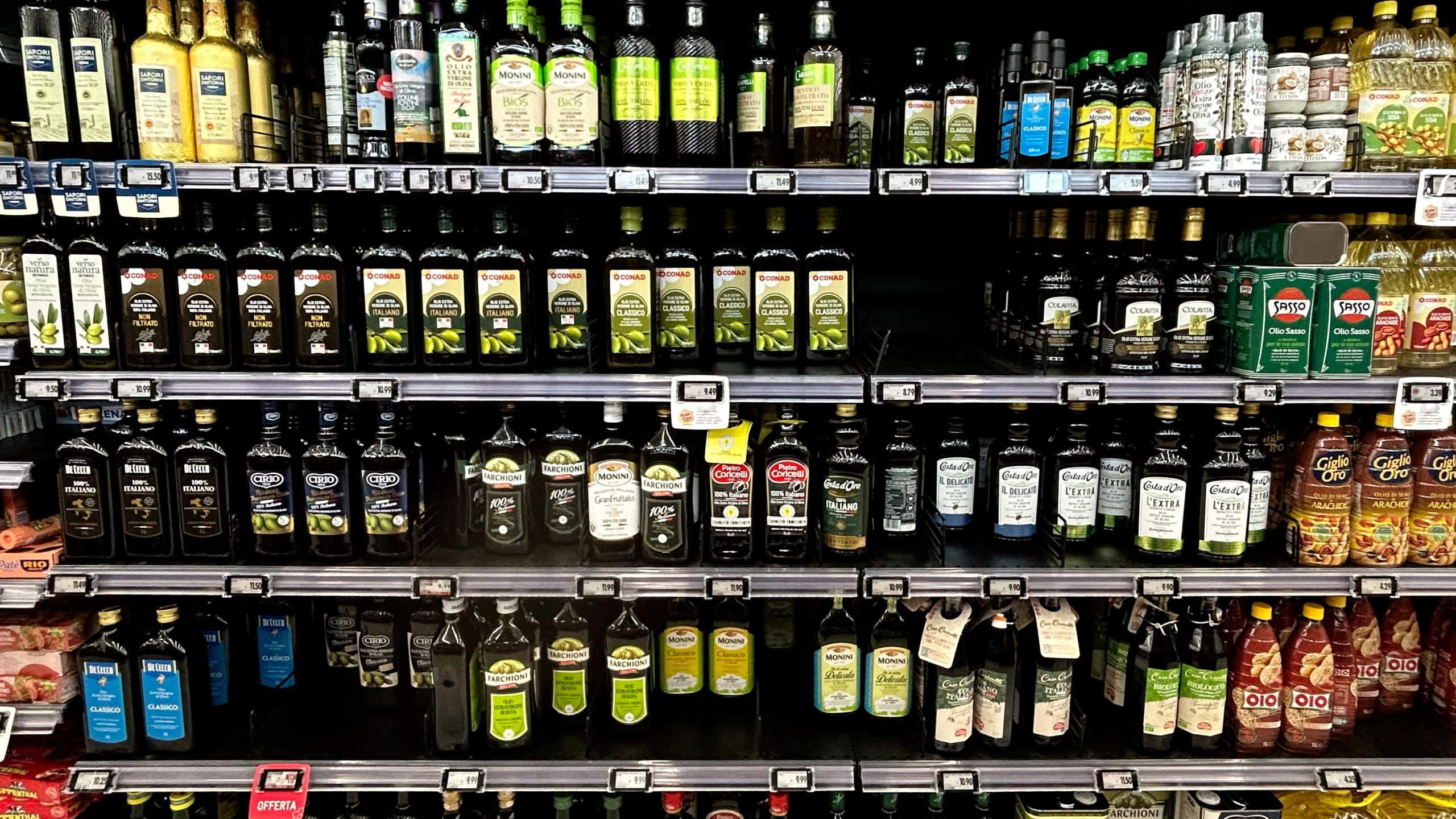 Olive oil bottles are seen in a supermarket in Rome, Friday, March 8, 2024. One-third of Italians have reduced their consumption of extra virgin olive oil due to skyrocketing prices, according to a survey released Friday. But Italian producers are pushing back against the data, saying the snapshot of consumer sentiment does not give a full picture — and that sales of higher-quality Italian extra virgin olive oil are actually up. (AP Photo/Alessandra Tarantino)
