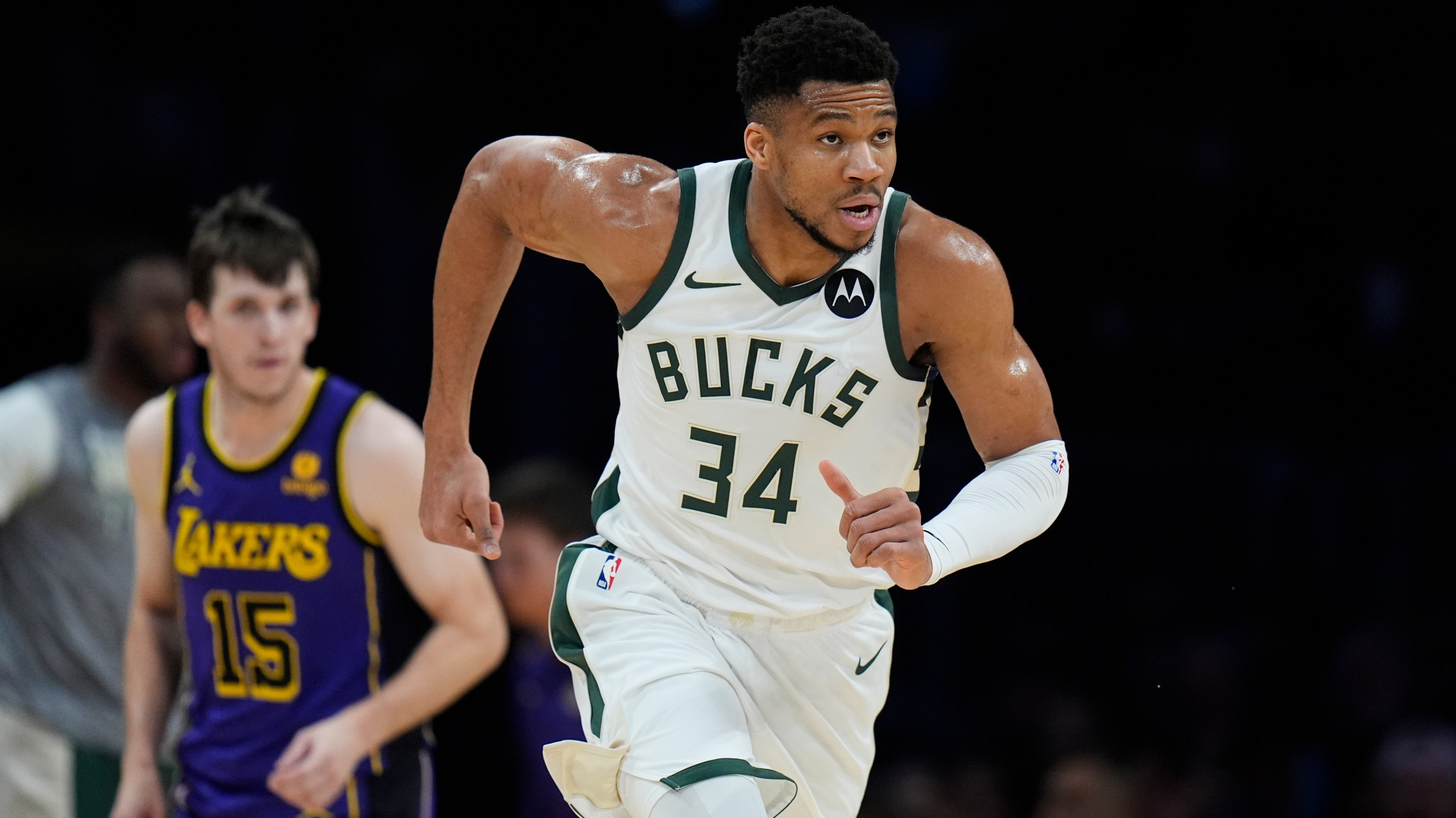Milwaukee Bucks forward Giannis Antetokounmpo (34) makes his way downcourt after making a basket during the first half of an NBA basketball game against the Los Angeles Lakers, Friday, March 8, 2024, in Los Angeles. (AP Photo/Jae C. Hong)