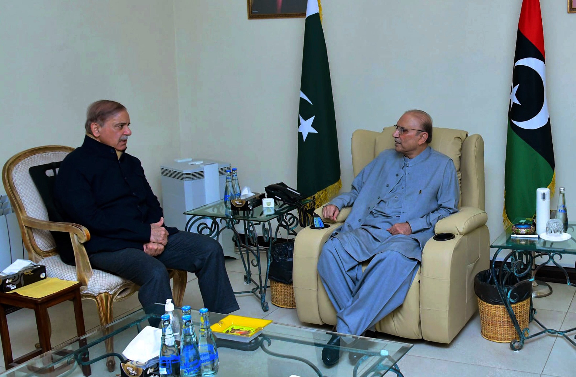 In this photo released by Prime Minister Office, Prime Minister Shehbaz Sharif, left, meets with newly election Pakistan's President Asif Ali Zardari, in Islamabad, Pakistan, Saturday, March 9, 2023. Pakistan's lawmakers have chosen Zardari as the country's new president. It's his second time in the job. Zardari is the widower of assassinated former Premier Benazir Bhutto and the father of former Foreign Minister Bilawal Bhutto-Zardari, (Prime Minister Office via AP)