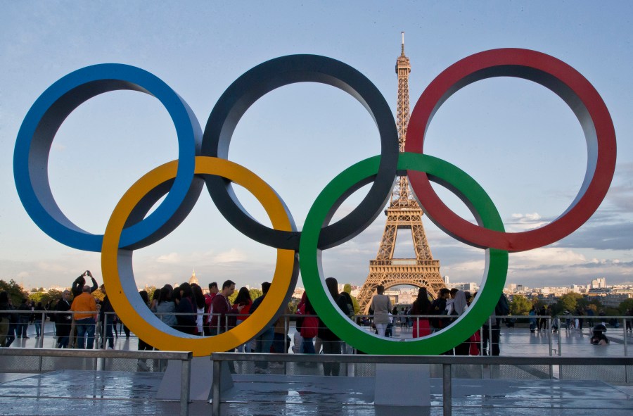 FILE - The Olympic rings are set up at Trocadero plaza that overlooks the Eiffel Tower in Paris on Sept. 14, 2017. A major French union is warning of possible strikes in the public sector, including at hospitals, during the Paris Olympics. The general secretary of the CGT tells France Info media that the union will give notice of a possible strike in public services during the Games, which are held in July-August. (AP Photo/Michel Euler, File)