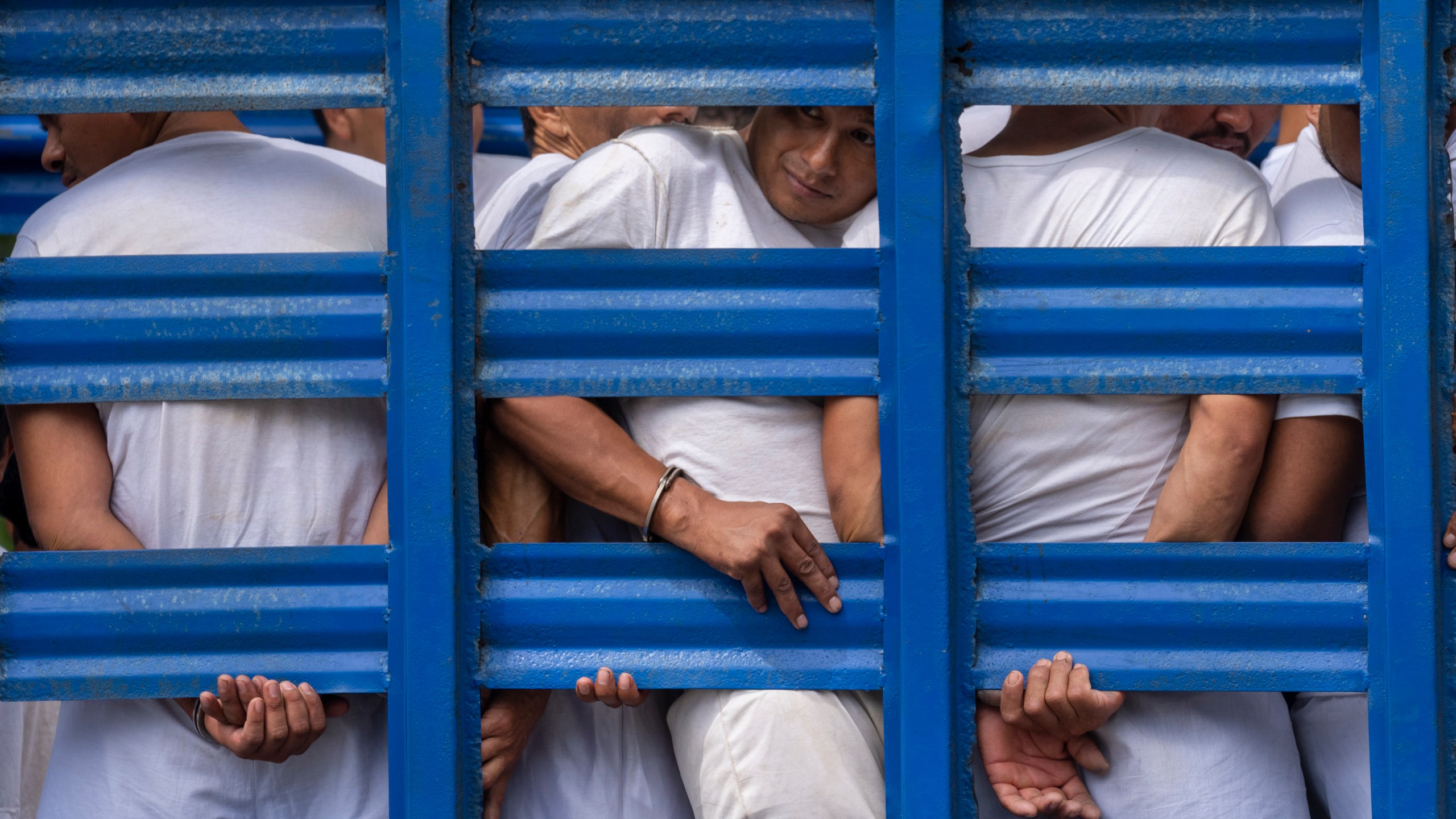 FILE - Men detained under a state of emergency are transported to a detention center in a cargo truck, in Soyapango, El Salvador, Friday, Oct. 7, 2022. Lawmakers on Friday, March 8, 2024, granted a request by President Nayib Bukele for the 24th consecutive one-month extension of an anti-gang emergency decree. (AP Photo/Moises Castillo, File)