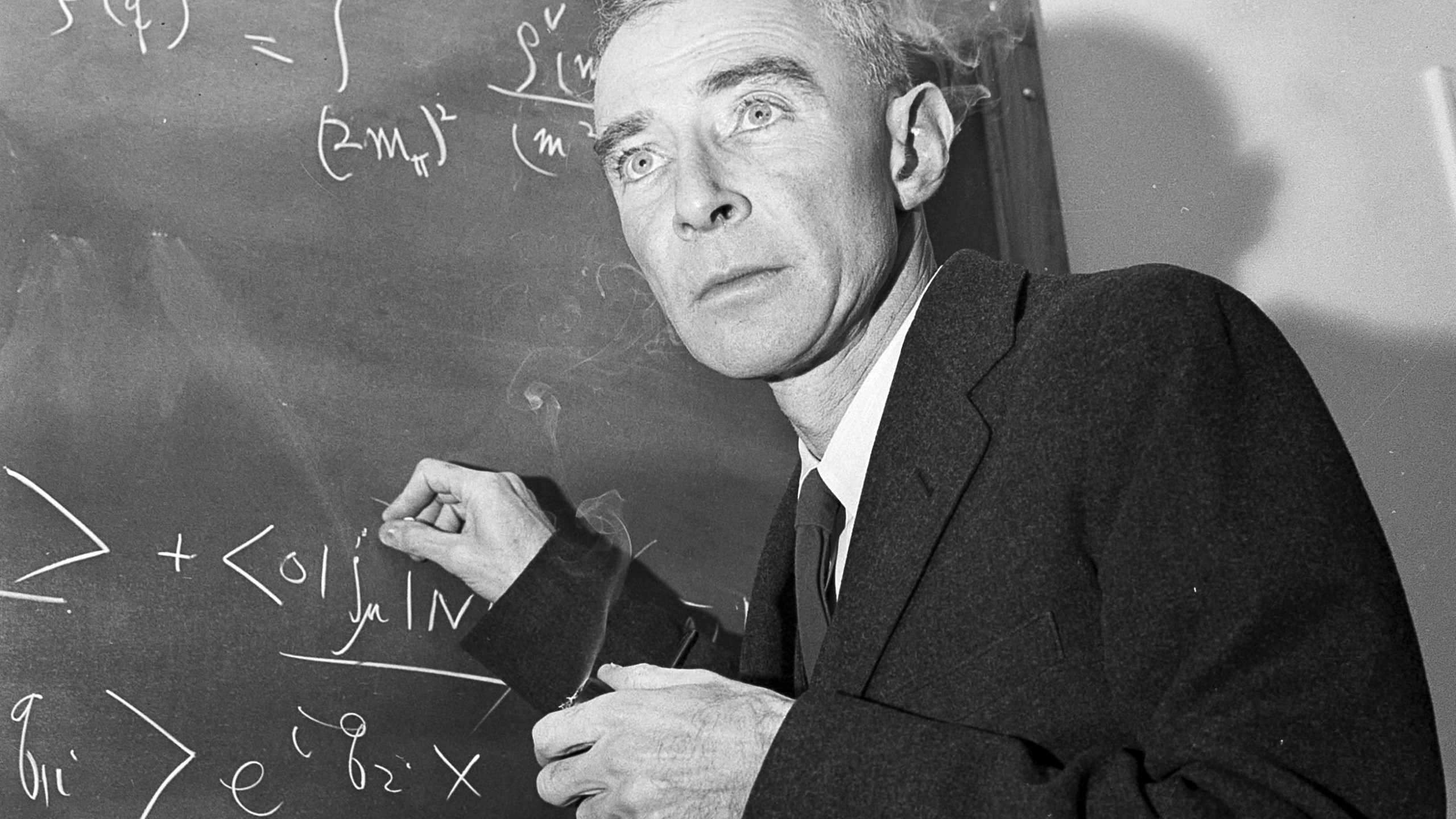 FILE - Dr. J. Robert Oppenheimer, creator of the atom bomb, is shown in his study at the Institute for Advanced Study, Dec. 15, 1957, in Princeton, N.J. RR Auction in Boston is taking bids on a rare 1945 report, as well as a letter to a journalist signed by “Opie” that describes the bomb as a “weapon for aggressors.” By Saturday, March 9, 2024, bids for the report had topped $35,000 while the letter was closing in on $5,000. The auction ends Wednesday, March 13. (AP Photo/John Rooney, File)